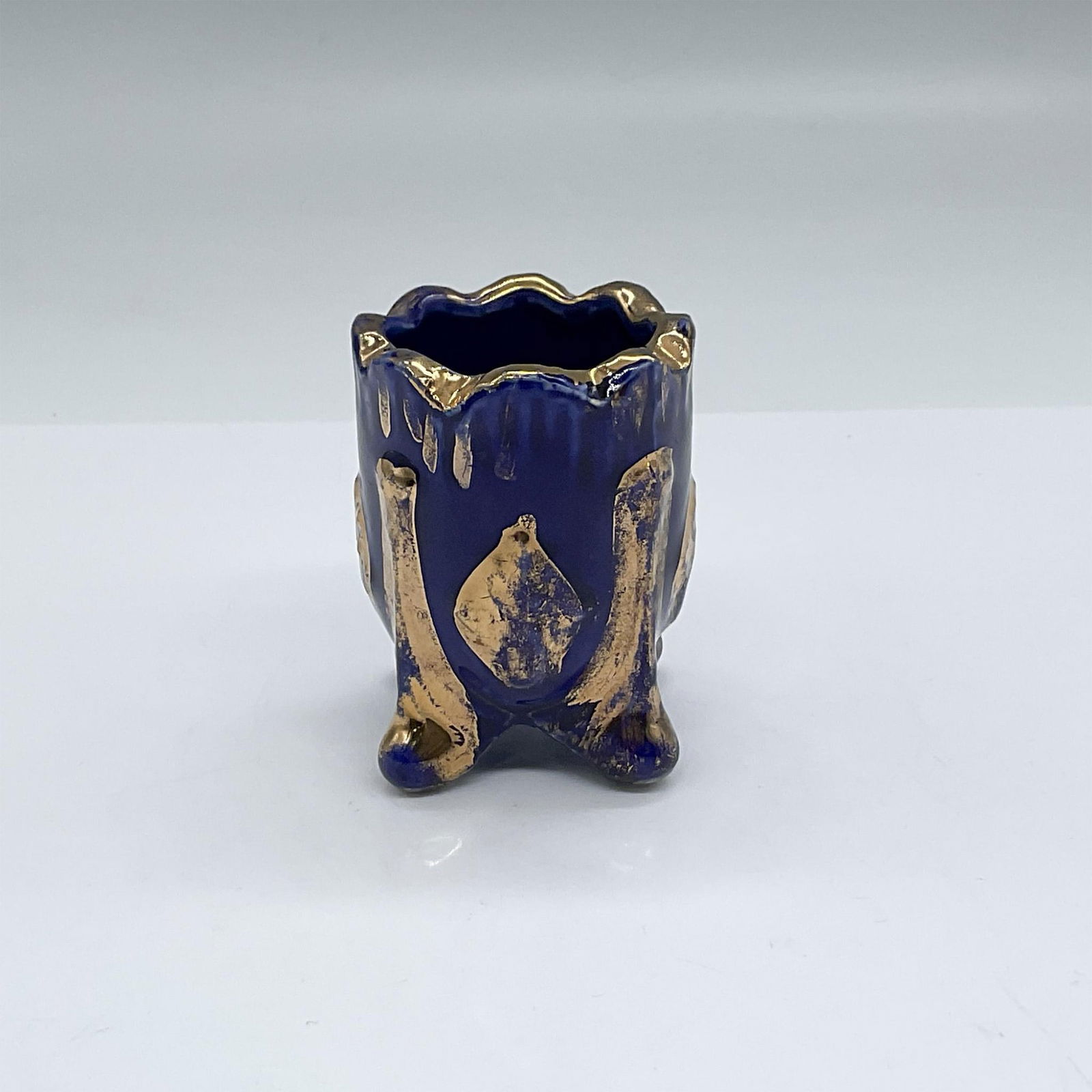 Cobalt Blue Toothpick Holder with Gold Accents: Cobalt blue footed toothpick holder. Gold detail rubbing off. Issued: 20th c. Dimensions: 2"dia. x 2.25"H
