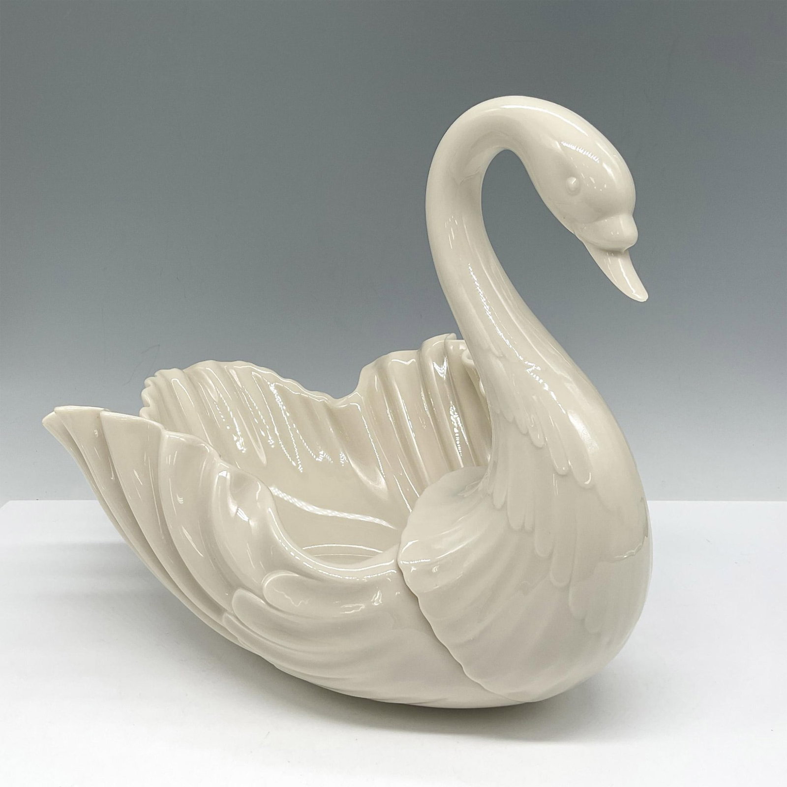 Lenox Porcelain Centerpiece Swan Dish: Elegant decorative piece with long sleek neck and wide wings. Lenox backstamp. Issued: 20th century Dimensions: 8.25"L x 11.5"W x 8.5"H Manufacturer: Lenox Country of Origin: United States