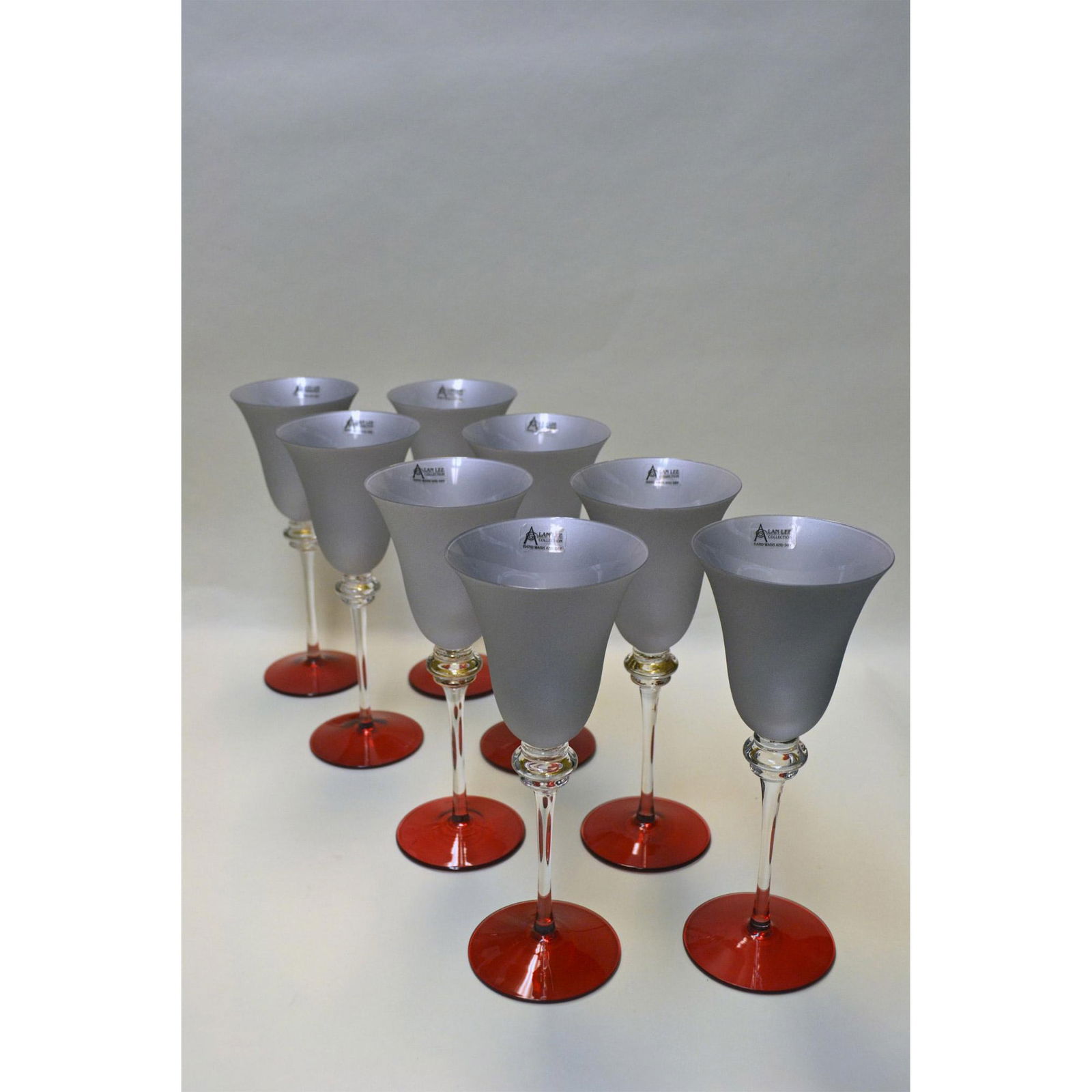 8Pc Alan Lee Crystal Wine Goblets, Silver Frost & Ruby: Alan Lee Collection, An Eight (8) Piece Collection of Tuscany Silver Frost and Ruby Crystal Wine Goblets. Silver Frost Bowl, Ruby Foot and a Clear Stem. Hand blown with crystal quality so superior, th