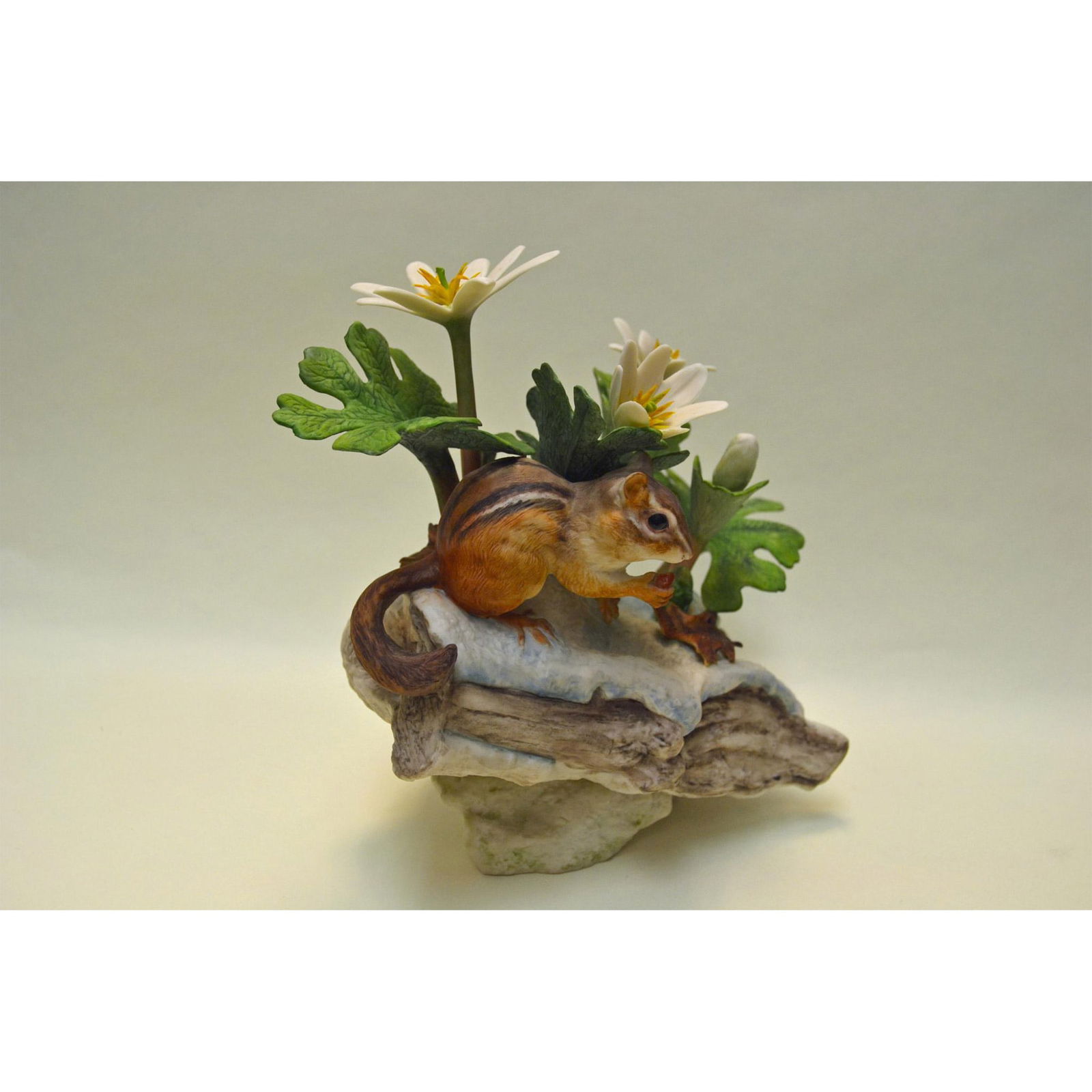 Cybis Porcelain Chipmunk with Bloodroot: Bisque Porcelain Decorated, hand created, hand painted by the Artisans of the Cybis Studios. Featuring a Limited Edition Chipmunk with Bloodroot from the Animal Kingdom & Woodland Series. Hallmark: 53