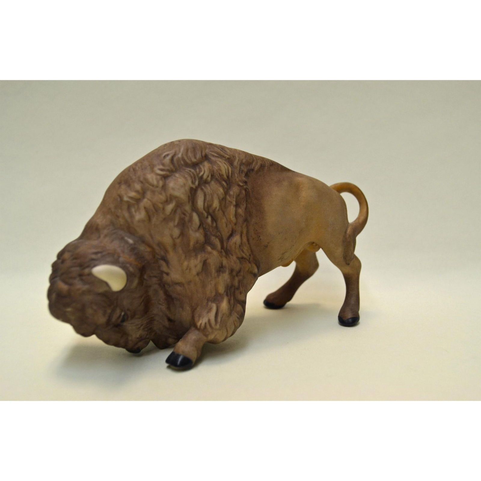 Cybis Porcelain Buffalo Sculpture: Bisque Porcelain Decorated, hand created, hand painted by the Artists of the Cybis Studios. Featuring the Brown Buffalo standing. Design Number: 640. Authentic Backstamp on the underside. Artist: Cybi