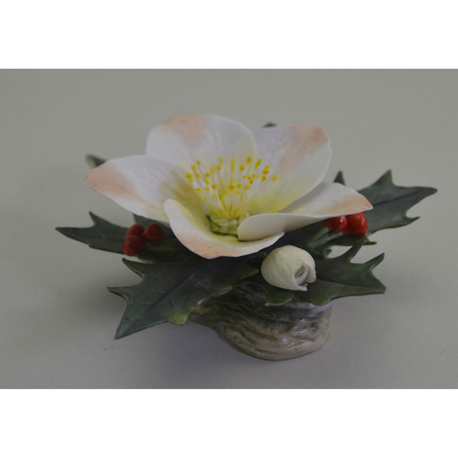 Connoisseur Porcelain Of Malvern, UK Christmas Rose Sculpture: English Fine Bone China, Bisque Decorated. Hand created, hand painted by the Connoisseur Studio Artists, featuring the Christmas Rose. Hallmark: Authentic Connoisseur Backstamp on the underside. Artis