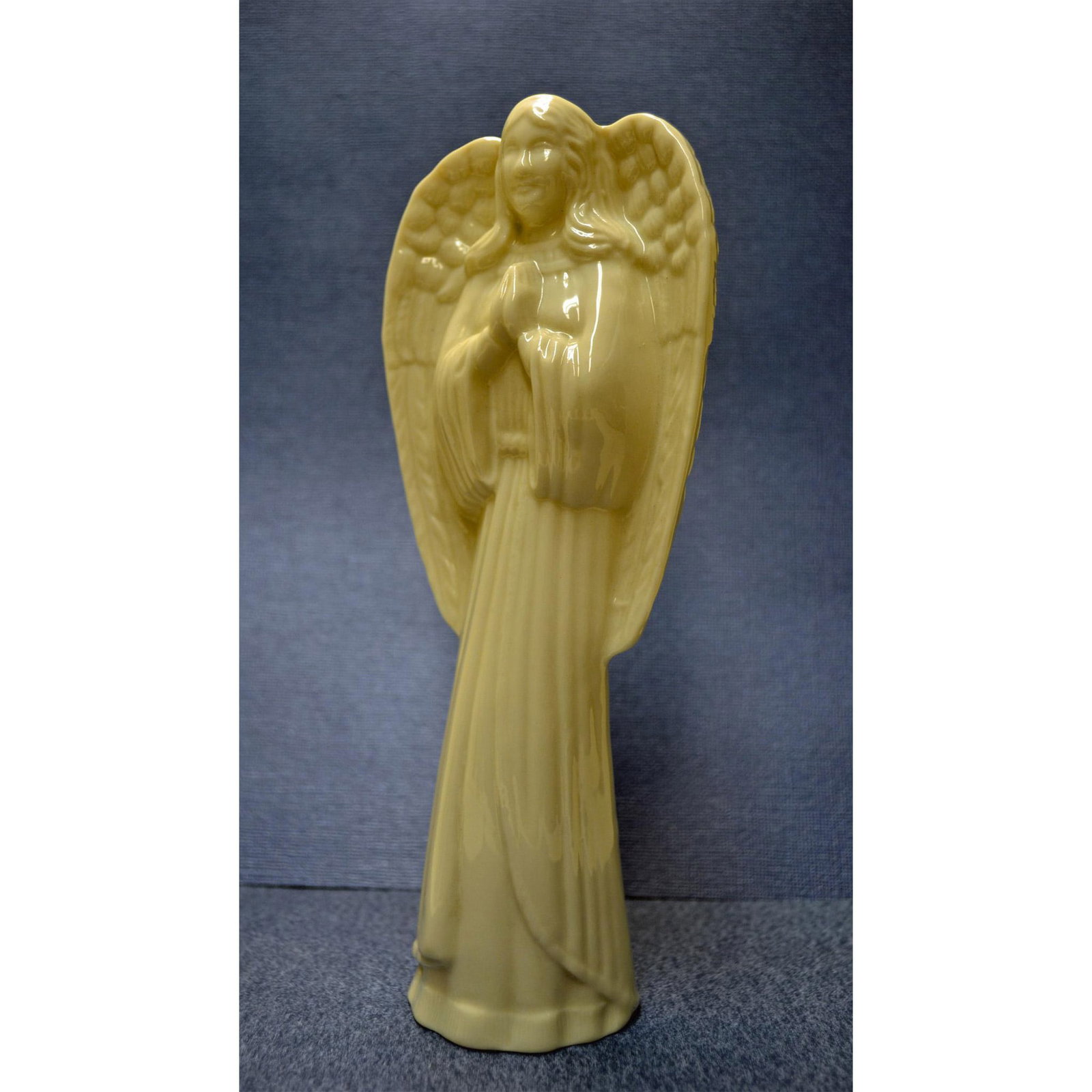 Belleek Porcelain Angel Tree Top, 1987: Ivory Porcelain Glazed, hand created, hand painted by the Belleek Artists, featuring an Angel Christmas Tree Top Figurine. Hallmark: Authentic Backstamp, inscribed Belleek. Artist: Belleek Issued: 198