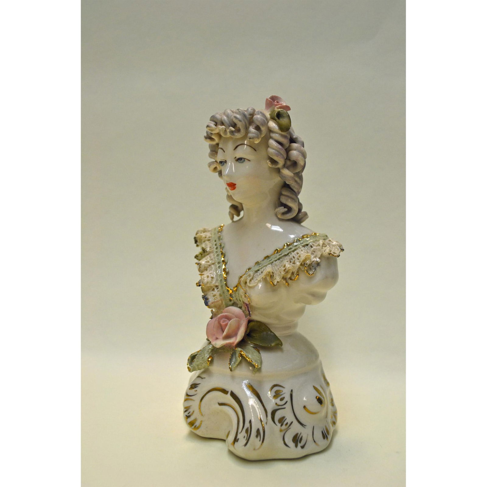 Cordey Porcelain Victorian Lady Bust W/Lace: Bisque Glazed Porcelain, hand created, hand painted by Bolesaw Cybis. Early and Rare featuring a Victorian Lady Figurine with Lace. Ivory Ruffle Lace, with a Pink Rose in her hair. Single Pink Rose wi