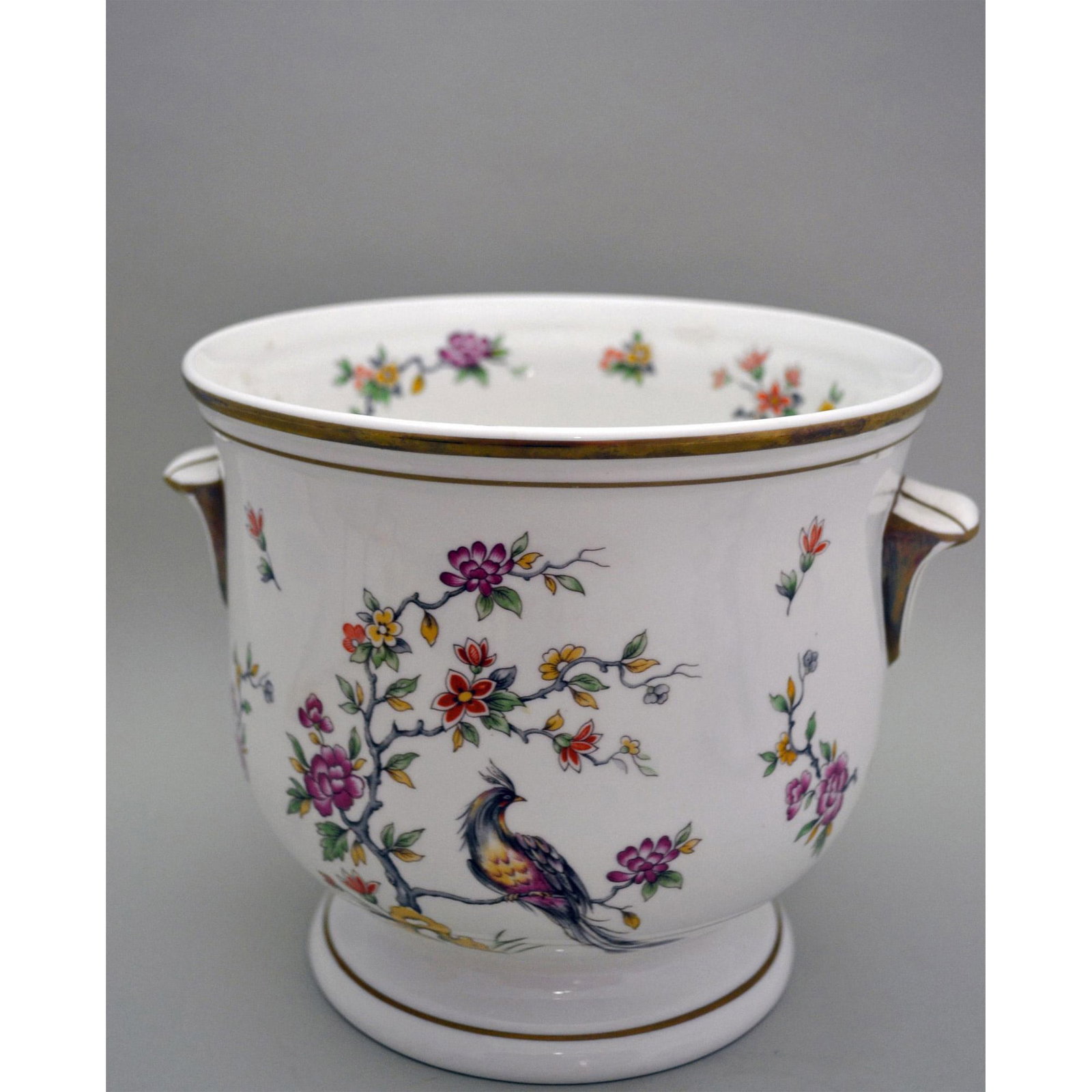 Princess Royale Porcelain Floral Planter: Glazed Fine Porcelain Decorated, Ivory Background with Magenta and Rust Florals on Organic Branches with Tropical Birds. Gold Trim around the Rim and Base. Beautifully painted by Princess Royal Porcel