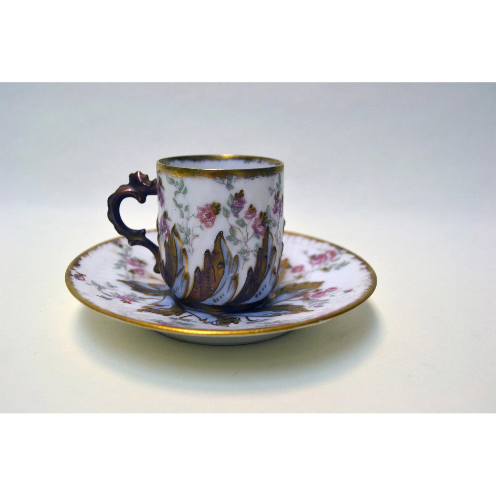 Limoges LS & S Porcelain Floral Cup And Saucer: Glazed Porcelain Decorated, Ivory Background, with Gold applied. Fine Bone China, Limoge France, featuring Pink Roses with gold accents and intricate detail. Hallmark: Limoges Backstamp. Artist: Limog