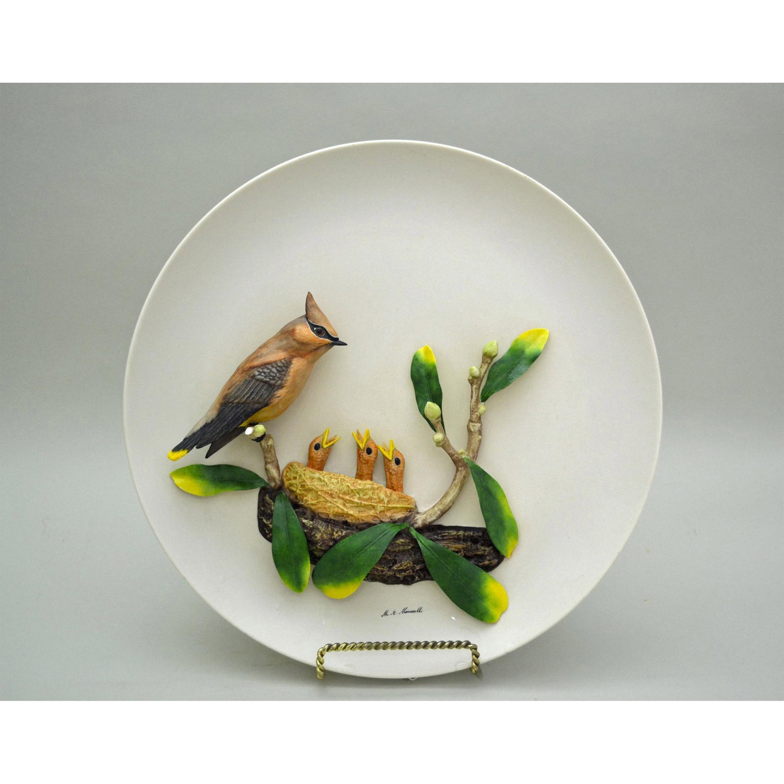 M.E. Moussalli Cedar Waxwing W/Young 3D Porcelain Plate: Bisque Porcelain Decorated, hand made, hand painted, presenting a Three (3) Dimensional Porcelain Plate featuring The Cedarwing Bird with Young. Celebrated Artist Moussalli has hand sculpted the Waxwi