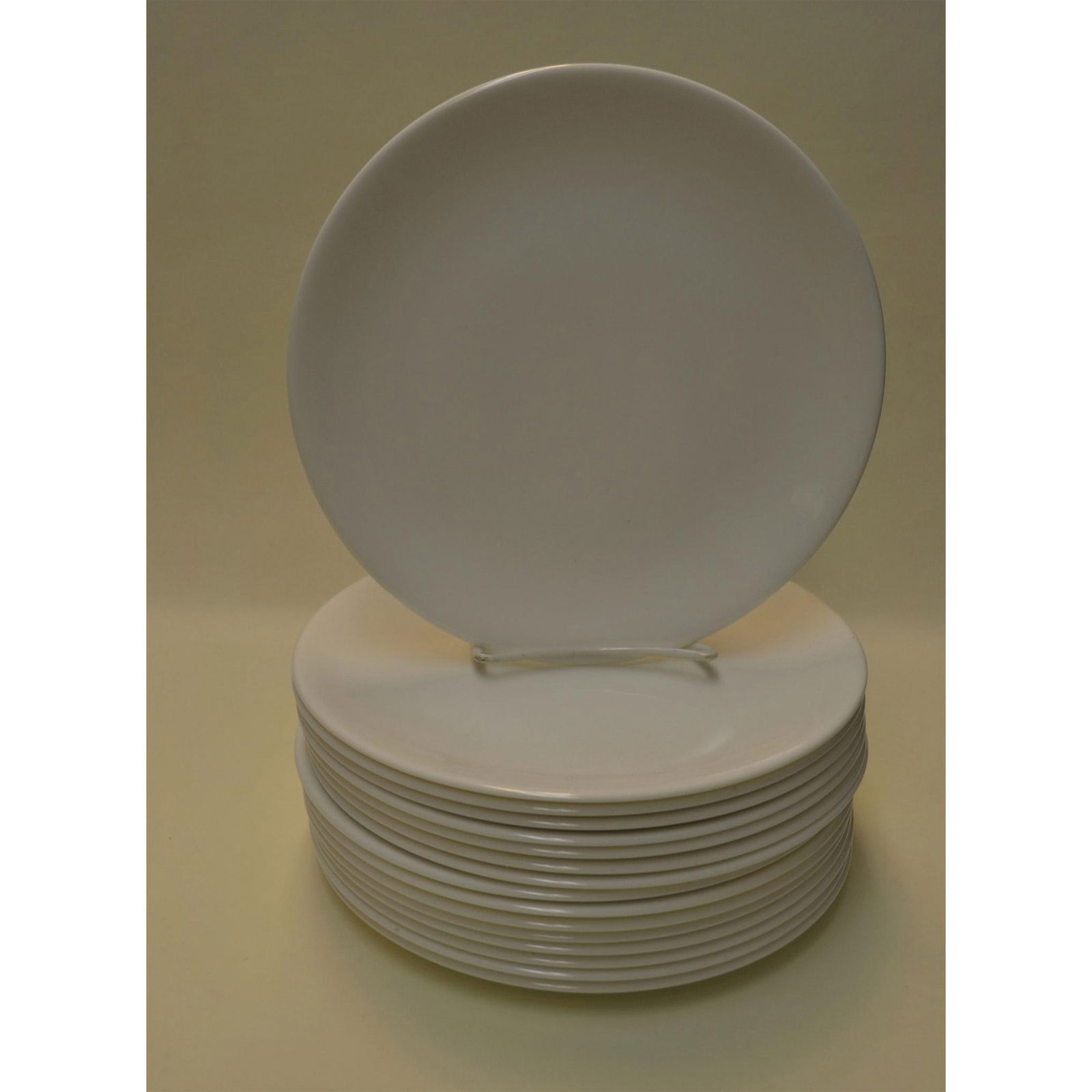 16Pc Fine Bone China White Serving Plates: English Fine Bone China White Glazed Serving Plates, hand created, hand painted. Each Glazed White. Contemporary, like new. Superior quality, elegant in style. Can be used as Main Serving Plates or De
