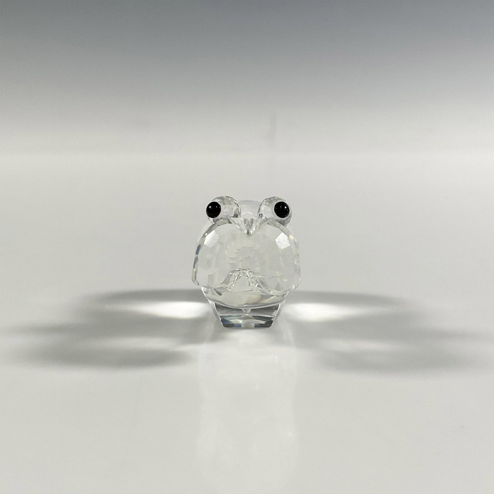 Swarovski Silver Crystal Hippopotamus Figurine: A clear faceted figure of a hippo with black eyes and a frosted tail. Swarovski marking. This item has its original box: 3.25"W x 2.5"H. Dimensions: 2"L x 0.75"W x 1"H Manufacturer: Swarovski Country 