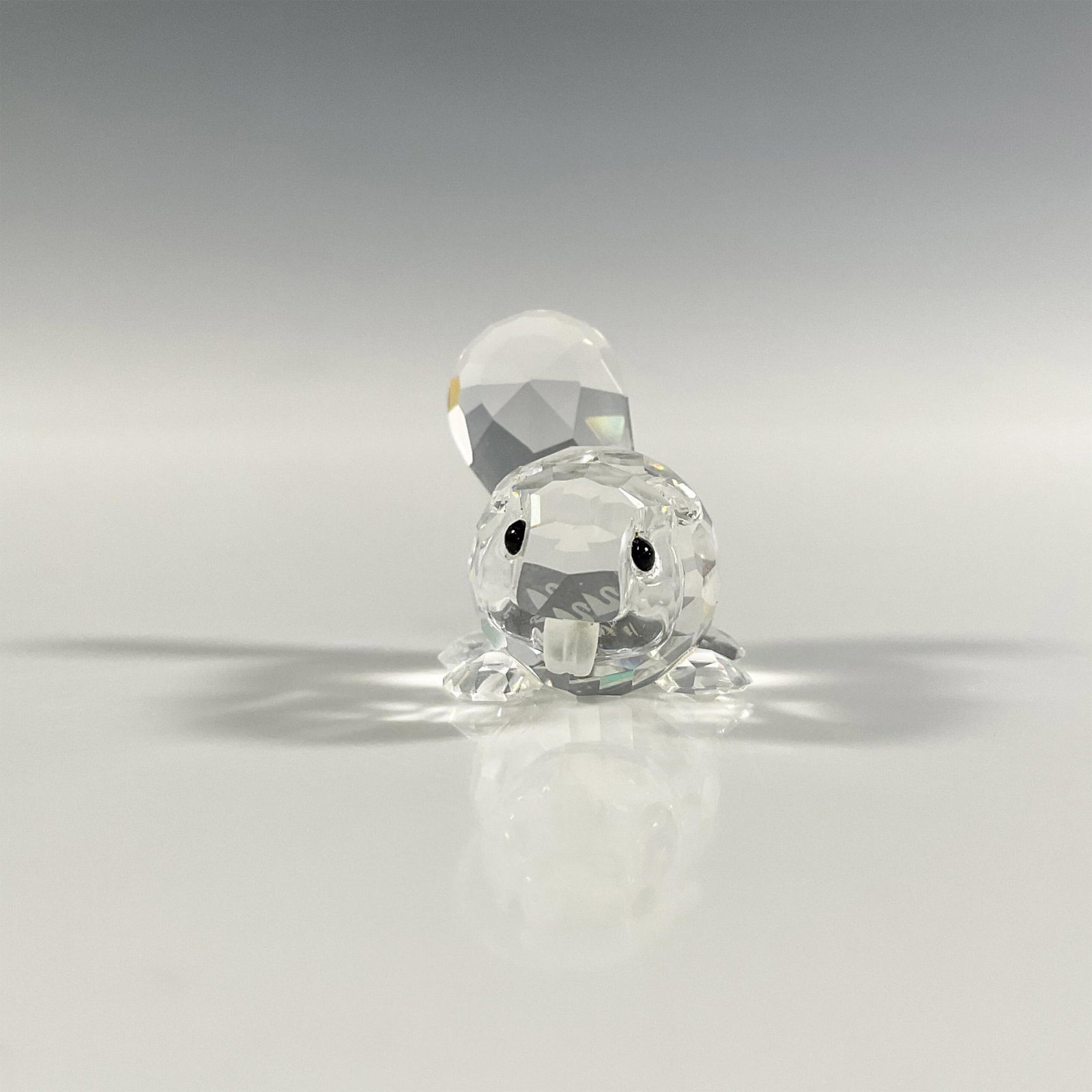 Swarovski Silver Crystal Baby Beaver Figurine: A clear faceted figure of a small beaver with frosted teeth and black eyes. Swarovski marking. This item has its original box: 3.25"W x 2.5"H. Dimensions: 1.5"L x 1"W x 1.25"H Manufacturer: Swarovski 