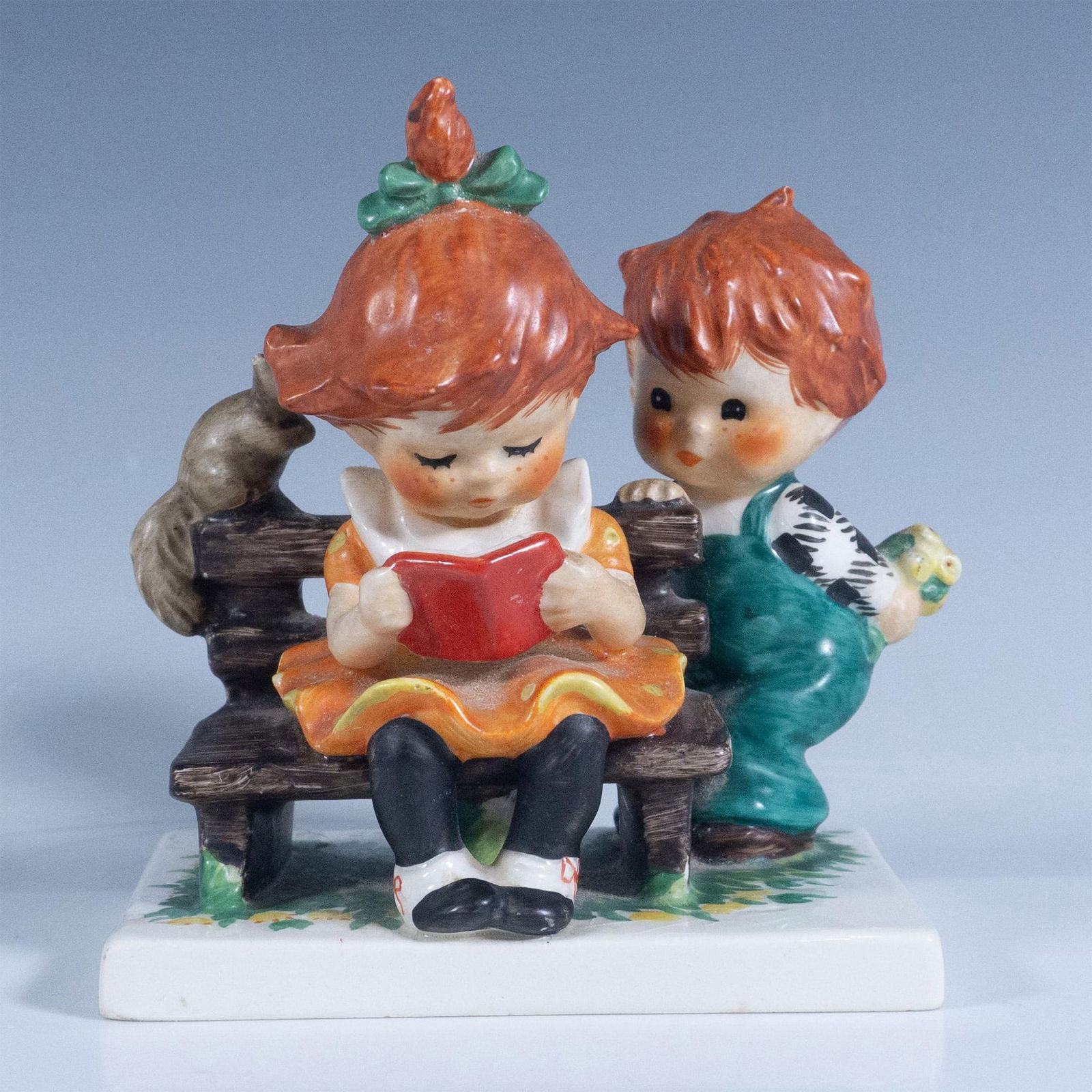 Goebel Charlot By Redheads Figurine, Young Man's Fancy: Matte finish in vivid colors. Features an adorable scene of a boy about to surprise a little girl. Goebel backstamp. Artist: Charlot Byj Issued: 1957 Dimensions: 2.75''L x 4.25''W x 4.5''H Manufacture