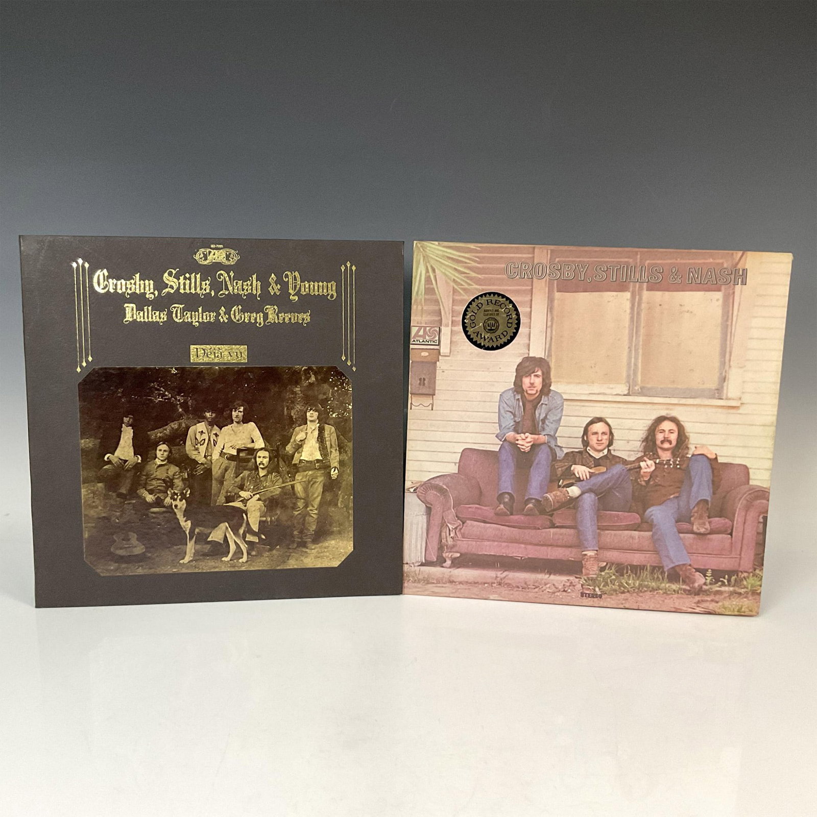 2pc Crosby, Stills, Nash & Young Vintage Vinyl Records: 2 vintage records: One for Crosby, Stills & Nash with songs like Marrakesh Express, Lady Of The Island, and more. The other record is Crosby, Stills, Nash & Young: Deja Vu with sons like Carry On, Our