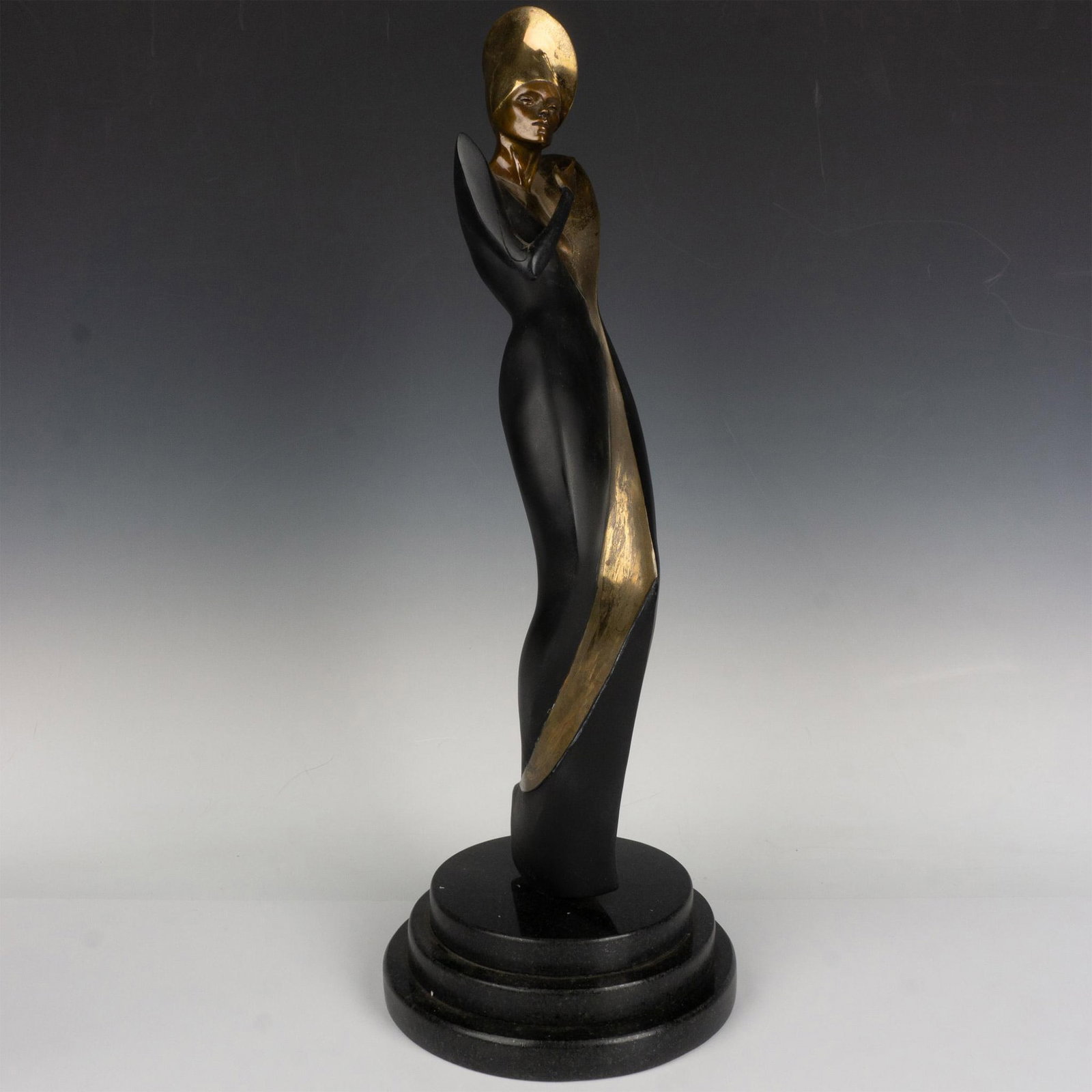 Ann Forman Bronze Sculpture, Woman Of the World: Ann Forman (American, b. 1942) is known for her sophisticated and voguish cast bronze sculpture. In 1987, the Dyansen Gallery proudly presented Forman's collection as the Ann Forman Sculpture Collecti