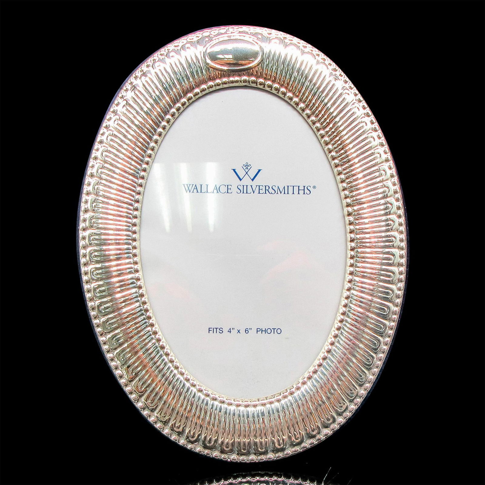 Wallace Silversmiths Sterling Silver Oval Bead Frame, 4 x 6: Beautiful glass and silver frame with blue velvet back. This item has its original box: 8.5"L x 7"W x 1"H. Issued: 20th century Dimensions: 8"H x 6"W Manufacturer: Wallace Silversmiths Country of Orig