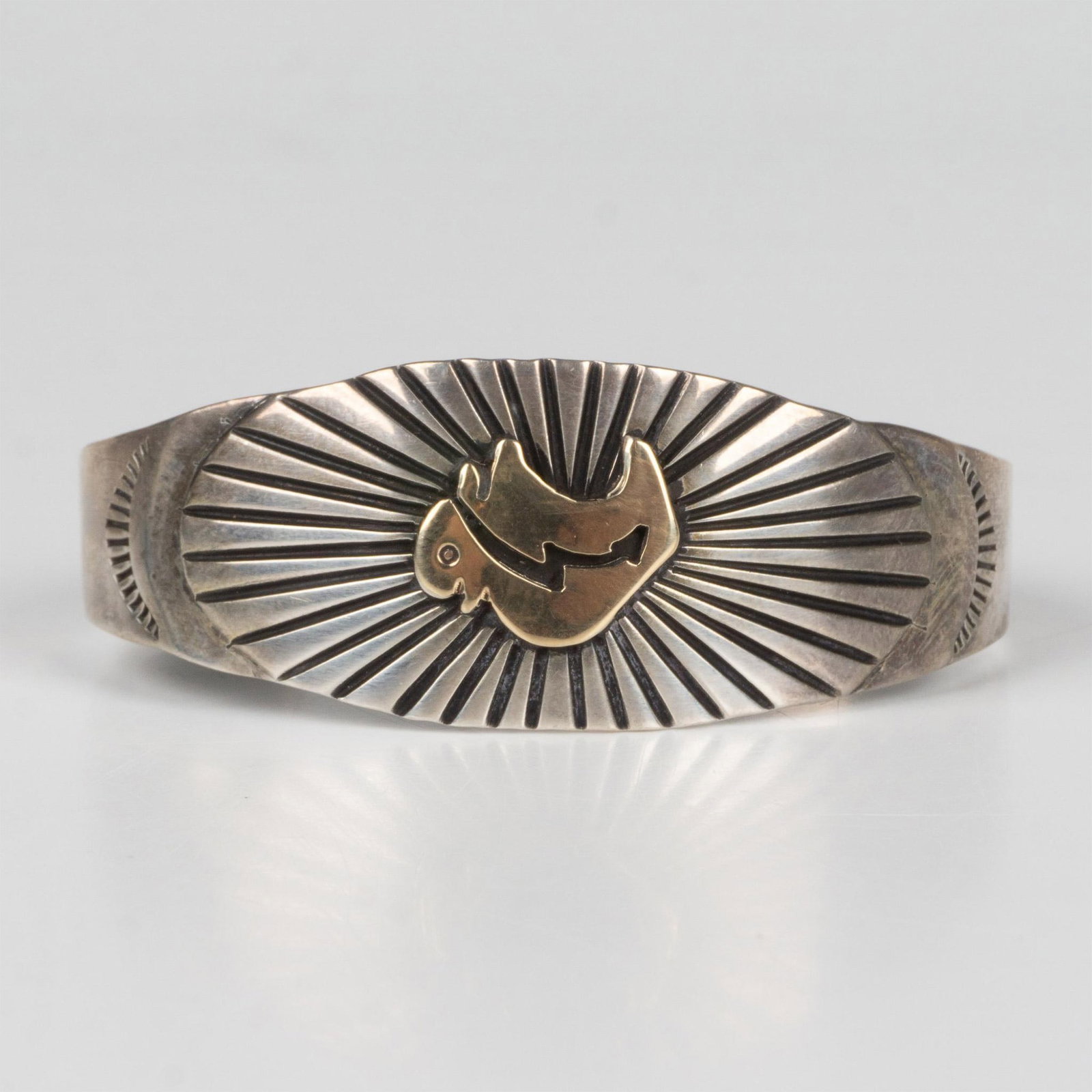 Yazzie & MM Rogers 14K Gold & Sterling Bison Cuff Bracelet: This gorgeous Southwestern Native American tribal bracelet was designed in 14k yellow gold and sterling silver by M.M. Rogers and E. Yazzie. Hallmarks on the inside. It measures approximately 5.5"L ar