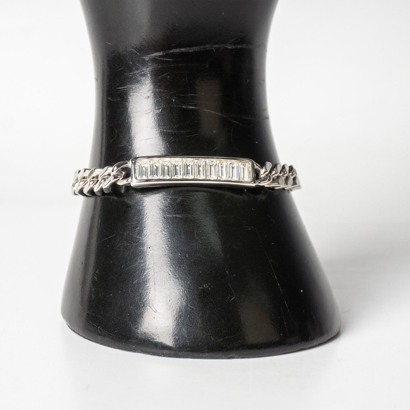 Swarovski Crystal Silver Metal ID Bracelet: Silver metal bracelet set with Swarovski crystals. Swarovski hallmarks. Dimensions: 7"L Manufacturer: Swarovski Country of Origin: Austria