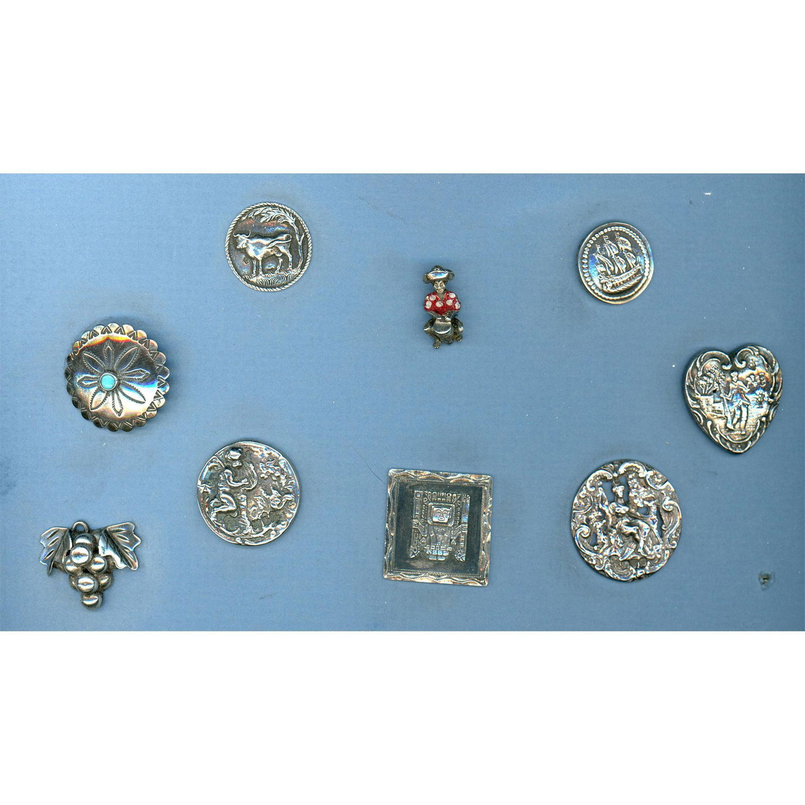 A partial card of division one and three silver buttons (1 of 4)