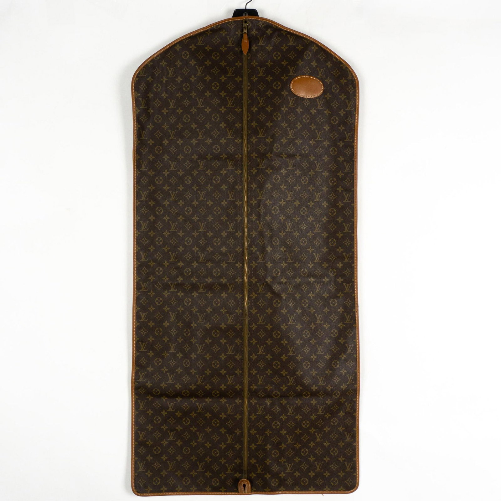 Vintage Louis Vuitton Garment Travel Bag: Stylish traveling carrier for coats, pants, shirts etc. by one of the most desirable brands in the industry, circa-1980's. Exterior leather print is the traditional Monogram pattern with interior, bro
