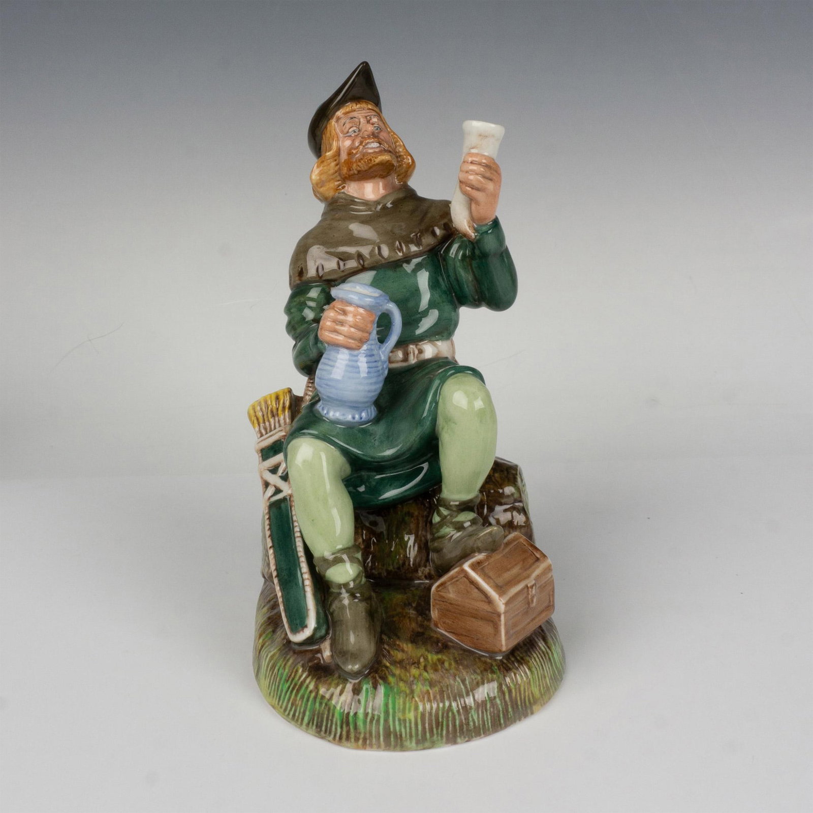 Robin Hood HN2773 - Royal Doulton Figurine: Depicts the iconic literary character in his signature green attire. Royal Doulton backstamp. Artist: William K. Harper Issued: 1985 - 1990 Dimensions: 7.75"H Manufacturer: Royal Doulton Country of O