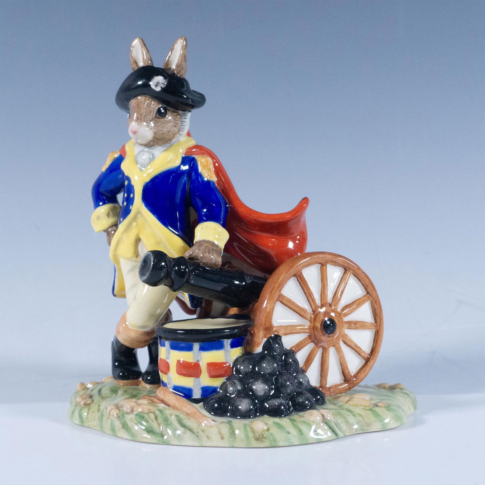 George Washington DB367 - Royal Doulton Bunnykins: Wearing a colorful uniform standing against a bombard. Royal Doulton backstamp. Artist: C. Dadd Issued: 20th century Dimensions: 5"H Edition Number: 431 of 2000 Manufacturer: Royal Doulton