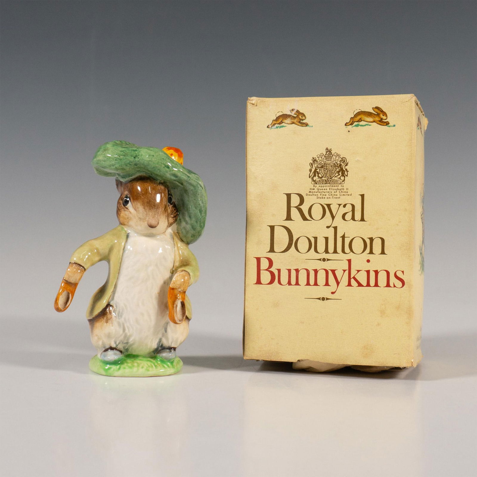 Beswick Beatrix Potter Figurine, Benjamin Bunny: Porcelain figure of the main character from the Beatrix Potter story The Tale of Benjamin Bunny wearing his green Tam o' Shanter hat. Beswick England backstamp. Includes original box: 2.75"L x 2.5"W x