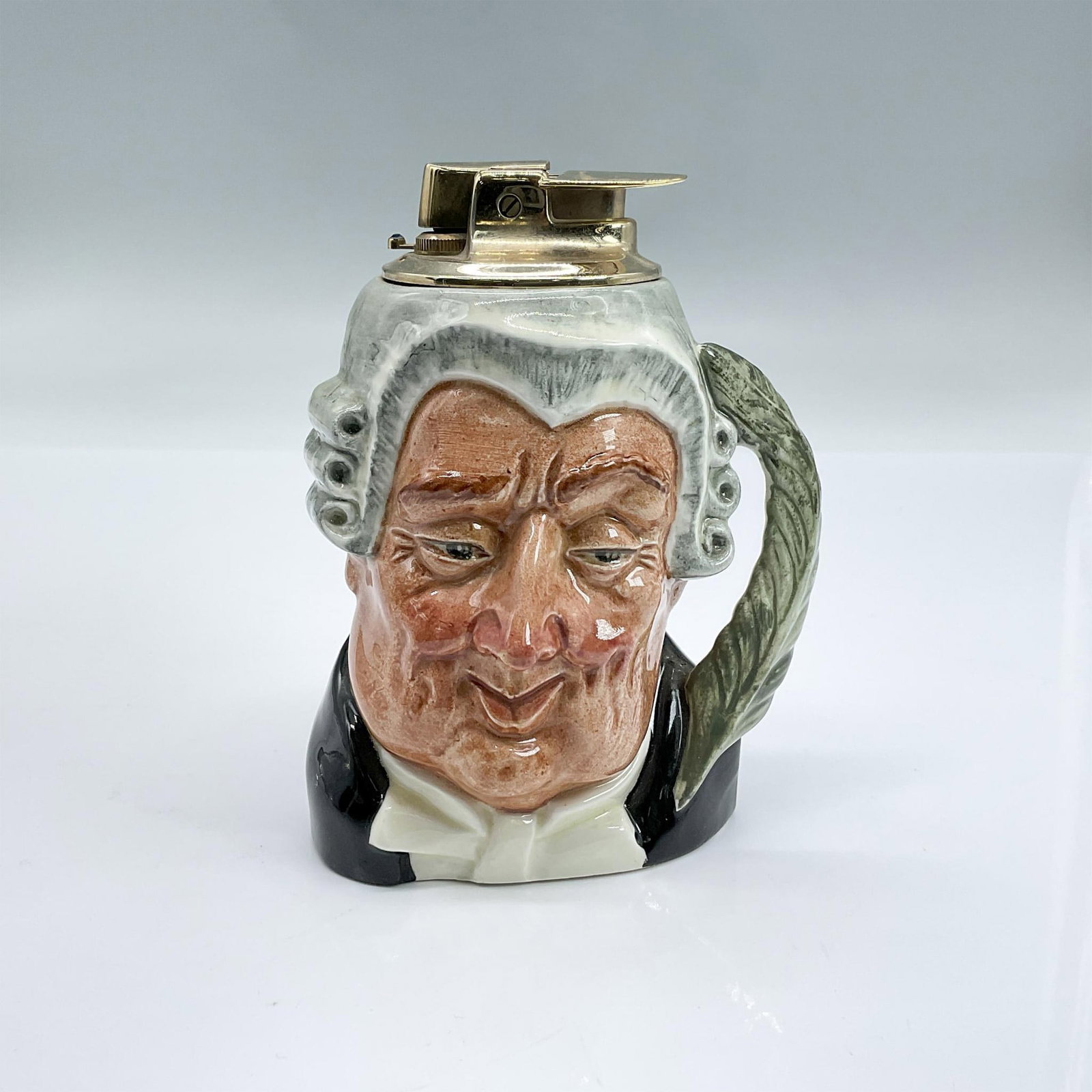 Lawyer D6504 - Royal Doulton Lighter: Grey wig; black robes; white shirt. Royal Doulton backstamp. Artist: Max Henk Issued: 1962 - 1974 Dimensions: 3.5"H Manufacturer: Royal Doulton Country of Origin: England