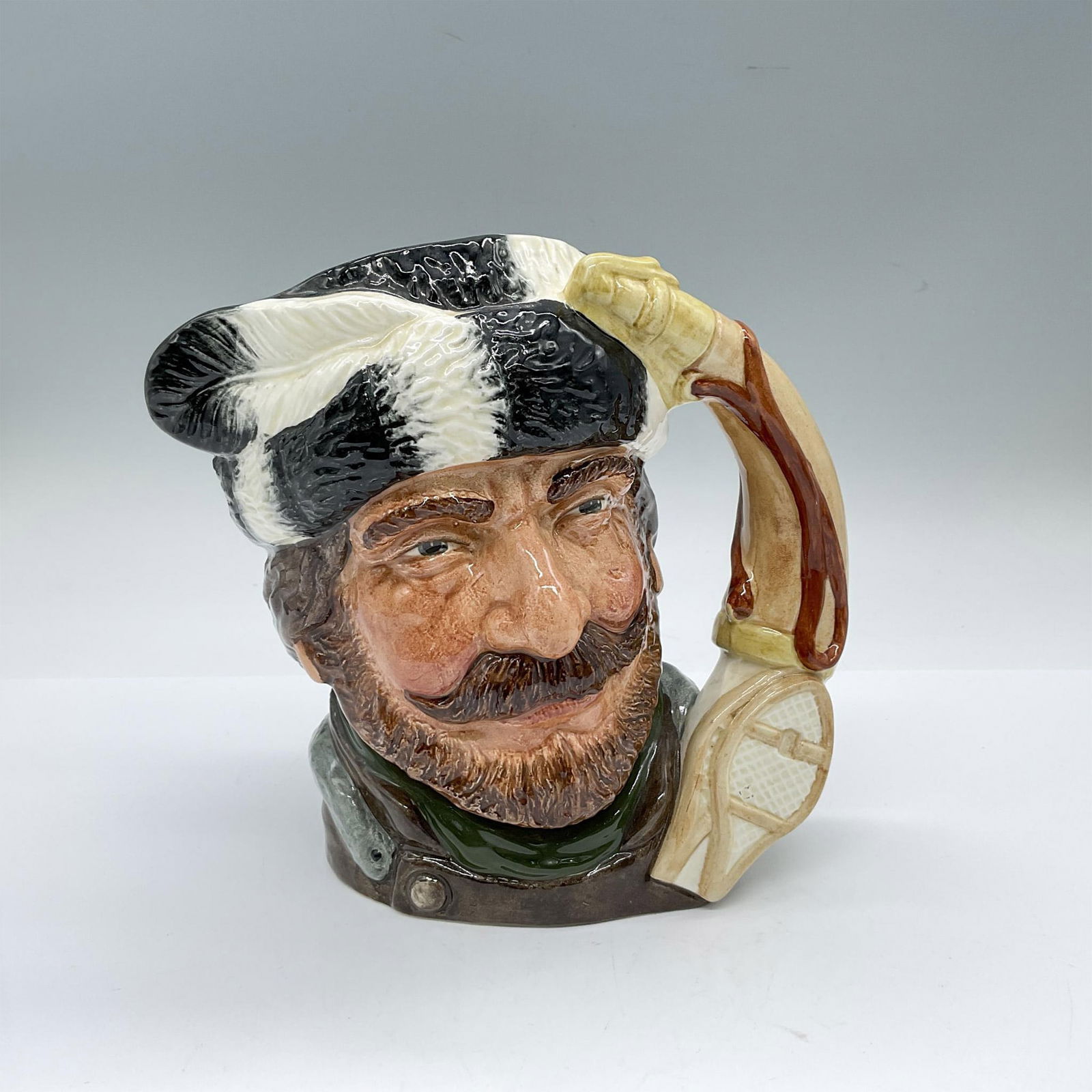 Trapper Centennial D6609 - Large - Royal Doulton Character Jug: Dark green and white hair; brown and green clothing. Series: Canadian Centennial Series 1867 - 1967. Royal Doulton and Centennial backstamp. Artist: Max Henk and David B. Biggs Issued: 1967 - 1967 Dim
