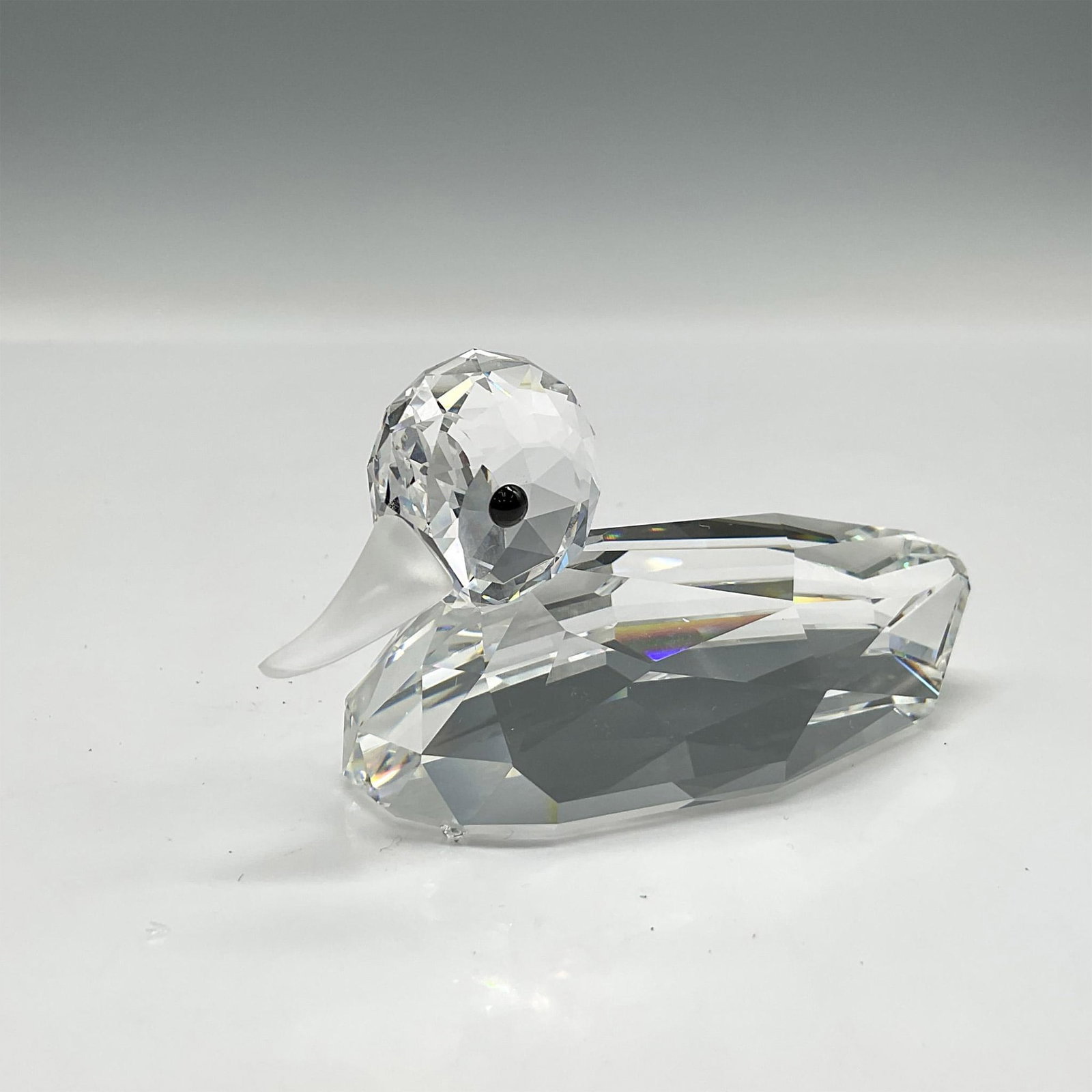 Swarovski Silver Crystal Figurine, Mallard Large: Part of the Beauties of the Lake group this beautiful clear faceted figural has jet crystal eyes and frosted crystal beak. Swarovski backstamp. 7647 080 000. This item has its original box: 6.25"H x 3