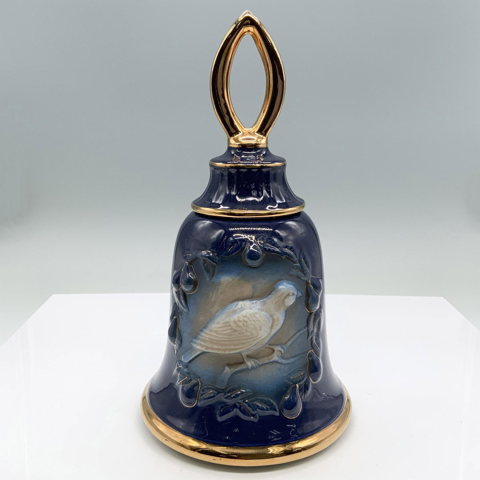 Vintage Jim Beam Porcelain Music Bell Whisky Decanter: Bell is colored in deep blue with center raised bird and fruit design. Gilt accents on handle, rims and on vines. Decanter was created for District 9, hosted by Valley Forge. Jim Beam and Regal China