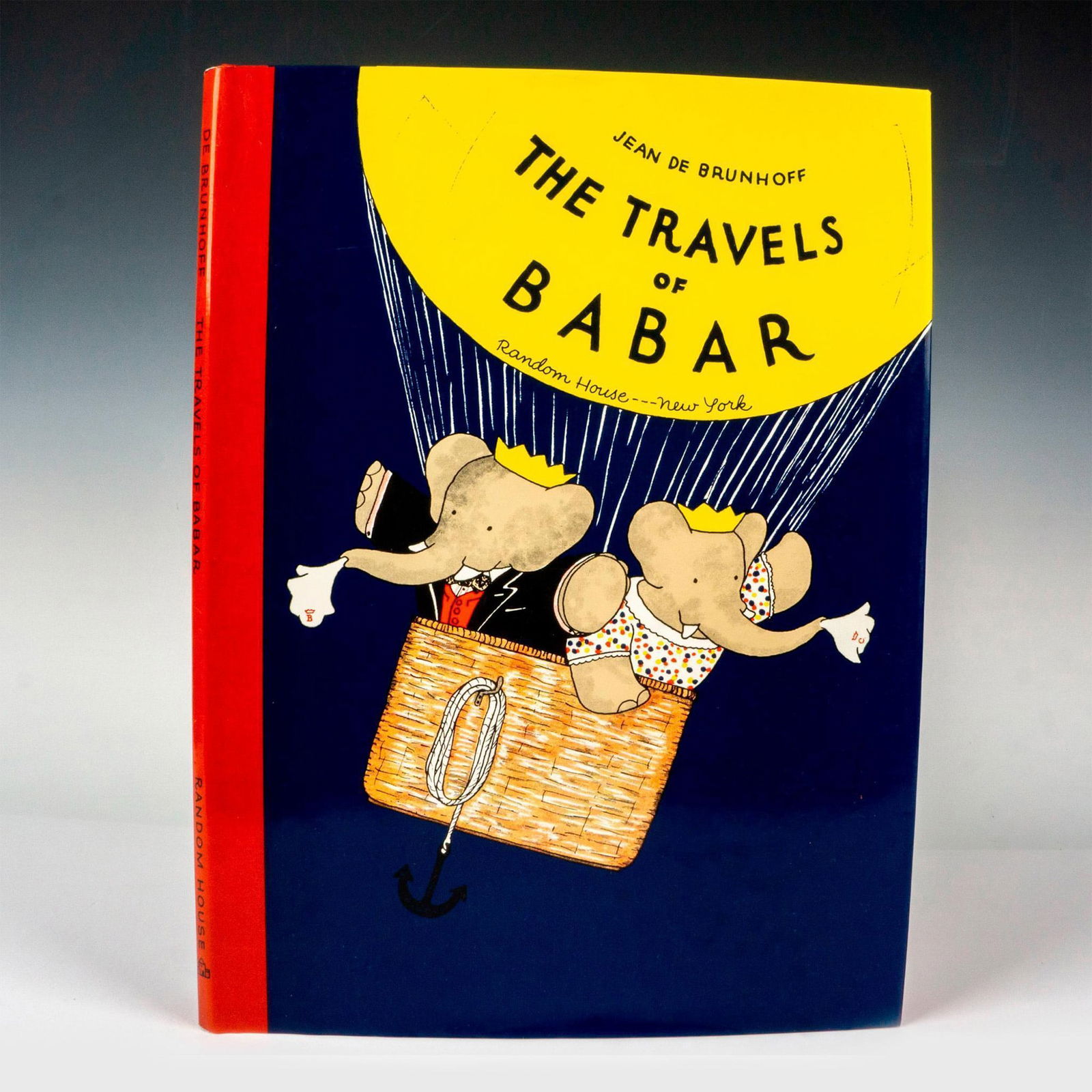 The Travels of Babar, Book by Jean De Brunhoff: New York: Random House, 1985. Navy-blue and red hardcover children's book with its original dust cover. Translated from the French by Merle Haas, 48-pages about Babar and his family with beautiful col