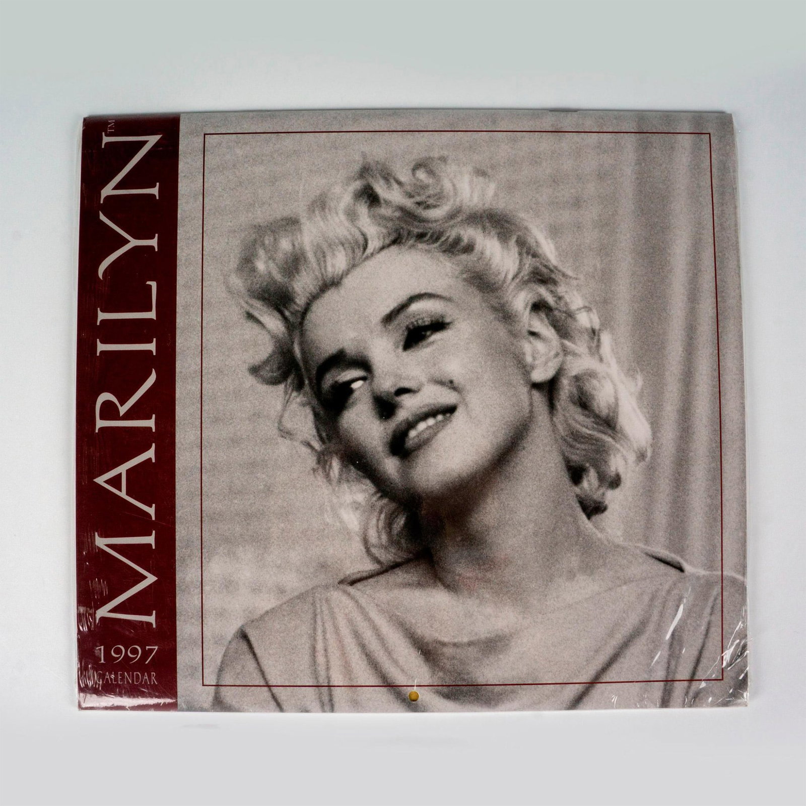 Pomegranate Calendars & Books, Marilyn 1997: Twelve month calendar with printed photographs depicting American actress Marilyn Monroe. Includes candid black and white images that perfectly capture the beauty and vulnerability of this American st