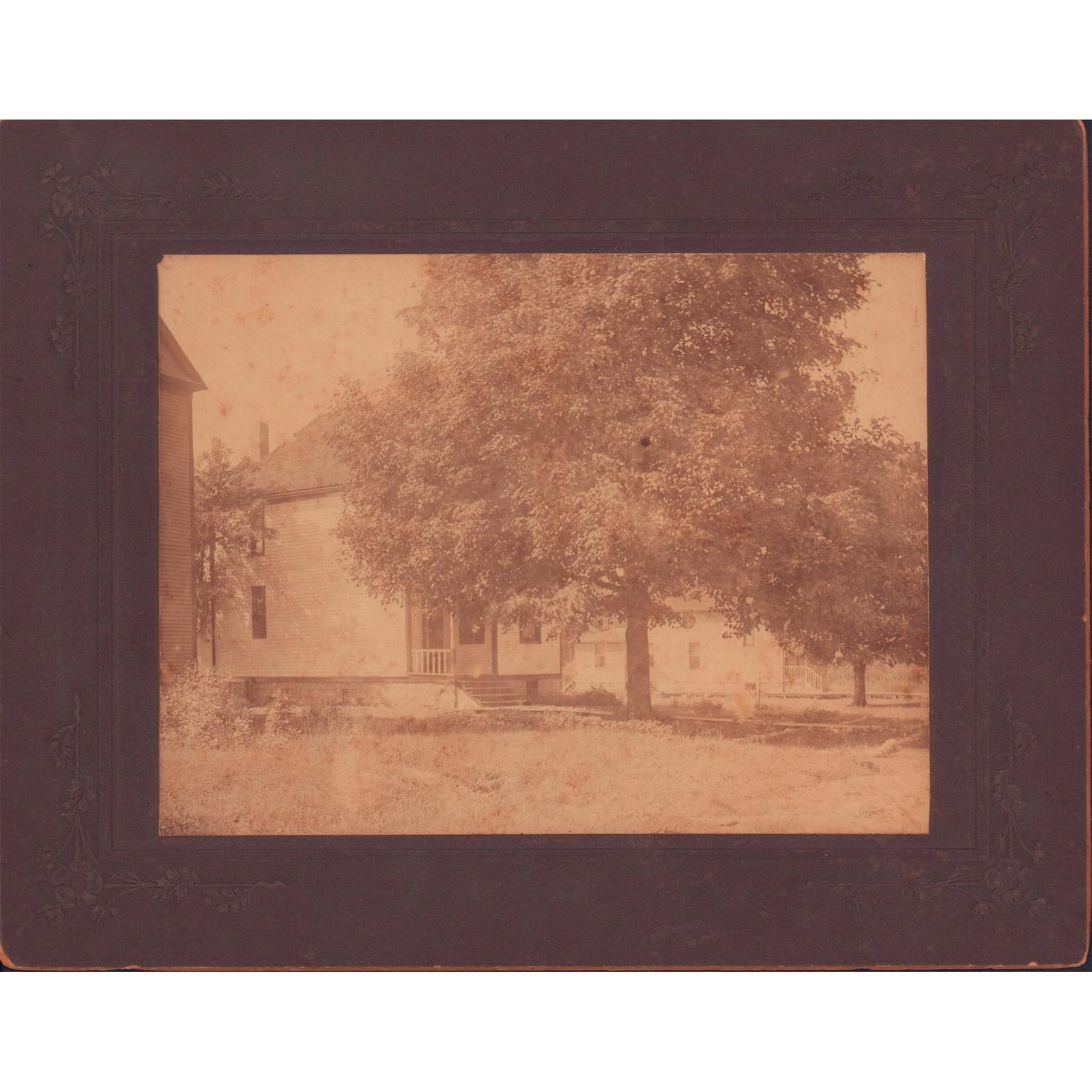 Antique Original Photograph, Victorian Farmhouse: Antique black and white photo depicting a Victorian farmhouse with a large tree, possibly maple, in the front yard. Silver gelatin print. Adhered to dark gray cardstock with floral embossing. Sight si