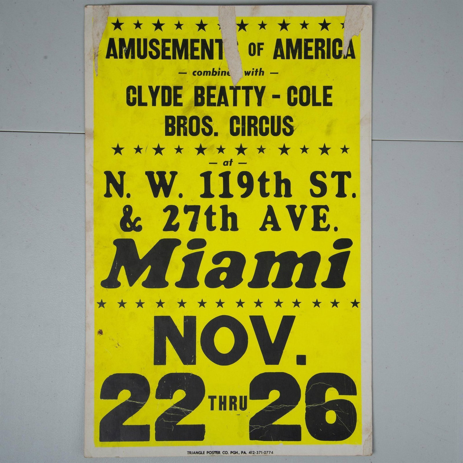 Vintage Amusements of America Poster: An eye-catching bright yellow with black text screen printed poster for Amusements of America featuring the Clyde Beatty- Cole Brothers Circus in Miami. An exciting piece of carnival ephemera. One can