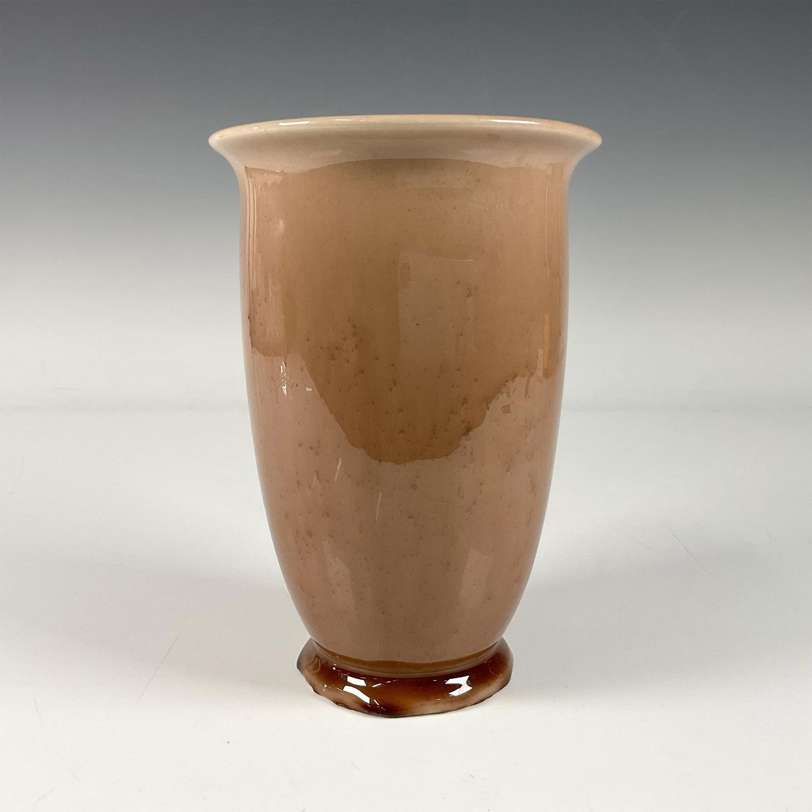 Rookwood 1944 Pottery Vase 6357: A glossy flared footed vessel with a brown glaze. Rookwood XLIV 6357 impressed marking. Issued: 1944 Dimensions: 4.5"W x 6.5"H Manufacturer: Rookwood Country of Origin: United States