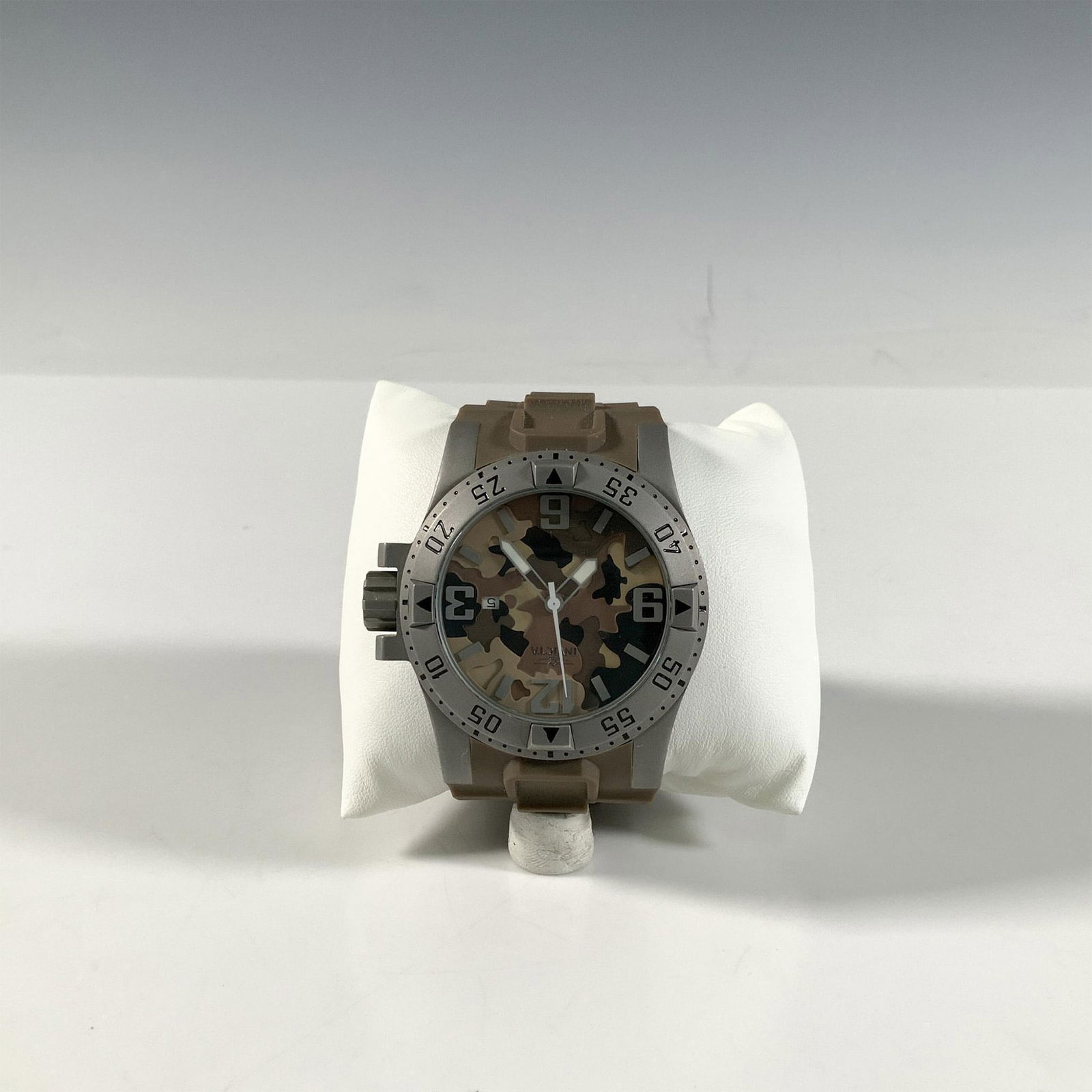 Invicta Excursion 1095 Brown Camouflage Watch: This watch has Swiss quartz movement and a stainless steel case with screw down crown and flame fusion crystal. The band measures approximately 10"L x 1"W. Water resistant 200m. Functionality not guar