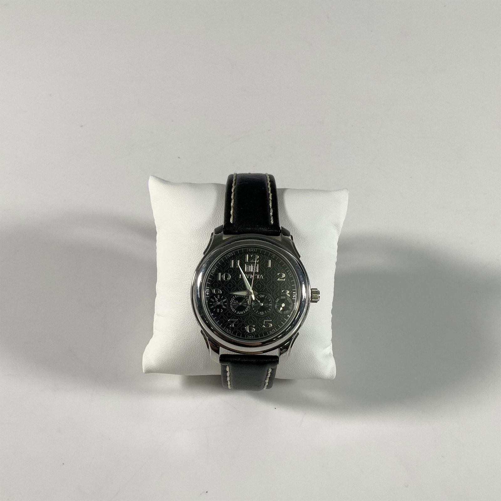 Invicta Objet d'Art 2170 Malaga Four Eye Chronograph Watch: This watch has a solid stainless steel case with see-thru back, screw down crown, black textured dial with silver year, month, day, date sub-dials, and luminous minute/hour hands. Swiss automatic move