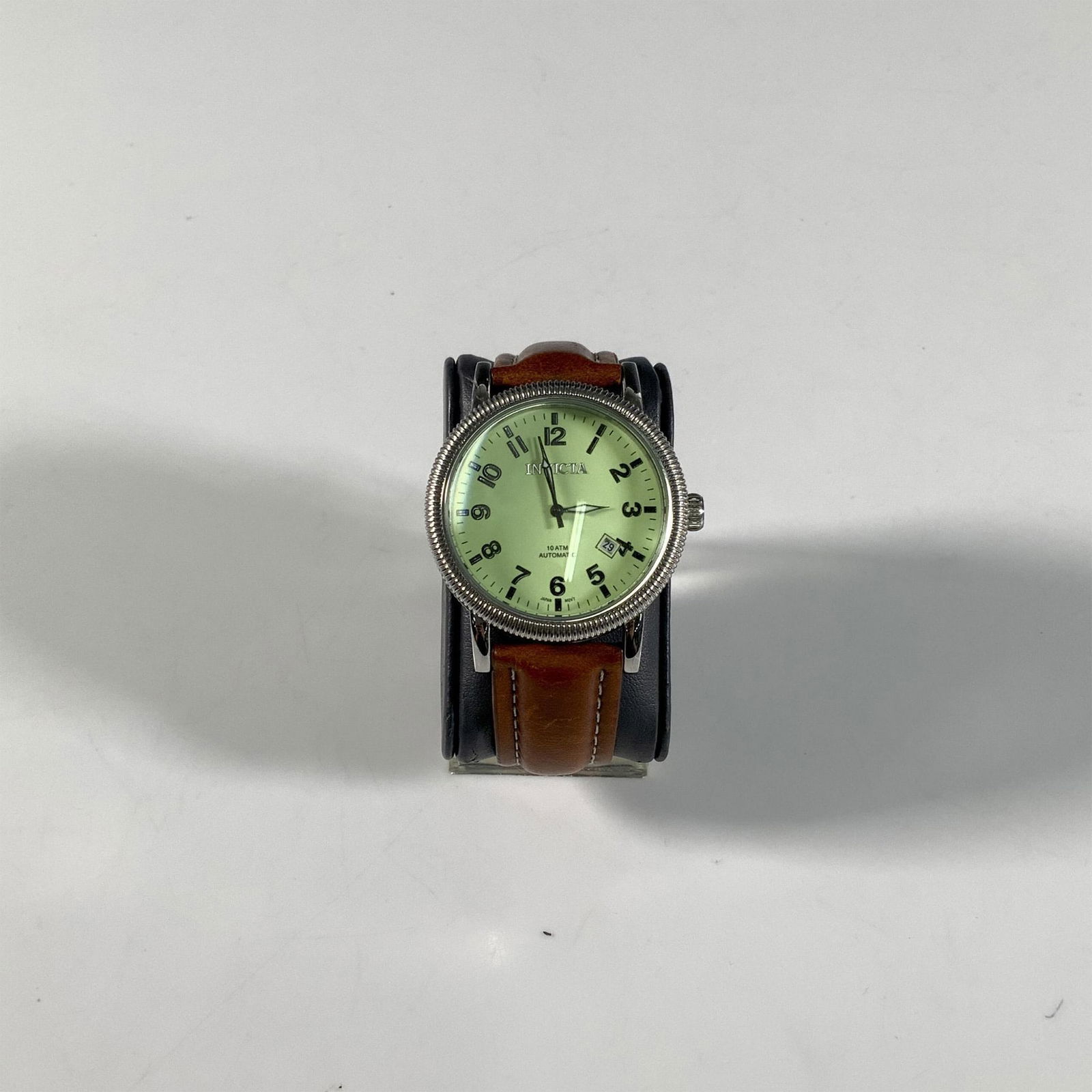 Invicta Vintage 2275 Auto Military Lume Dial Watch: This watch has Japan movement, 21 jewels, a stainless steel case with transparent back, and scratch resistant crystal. Luminous dial and hands with black numbers and markers. 10 ATM water resistant. I