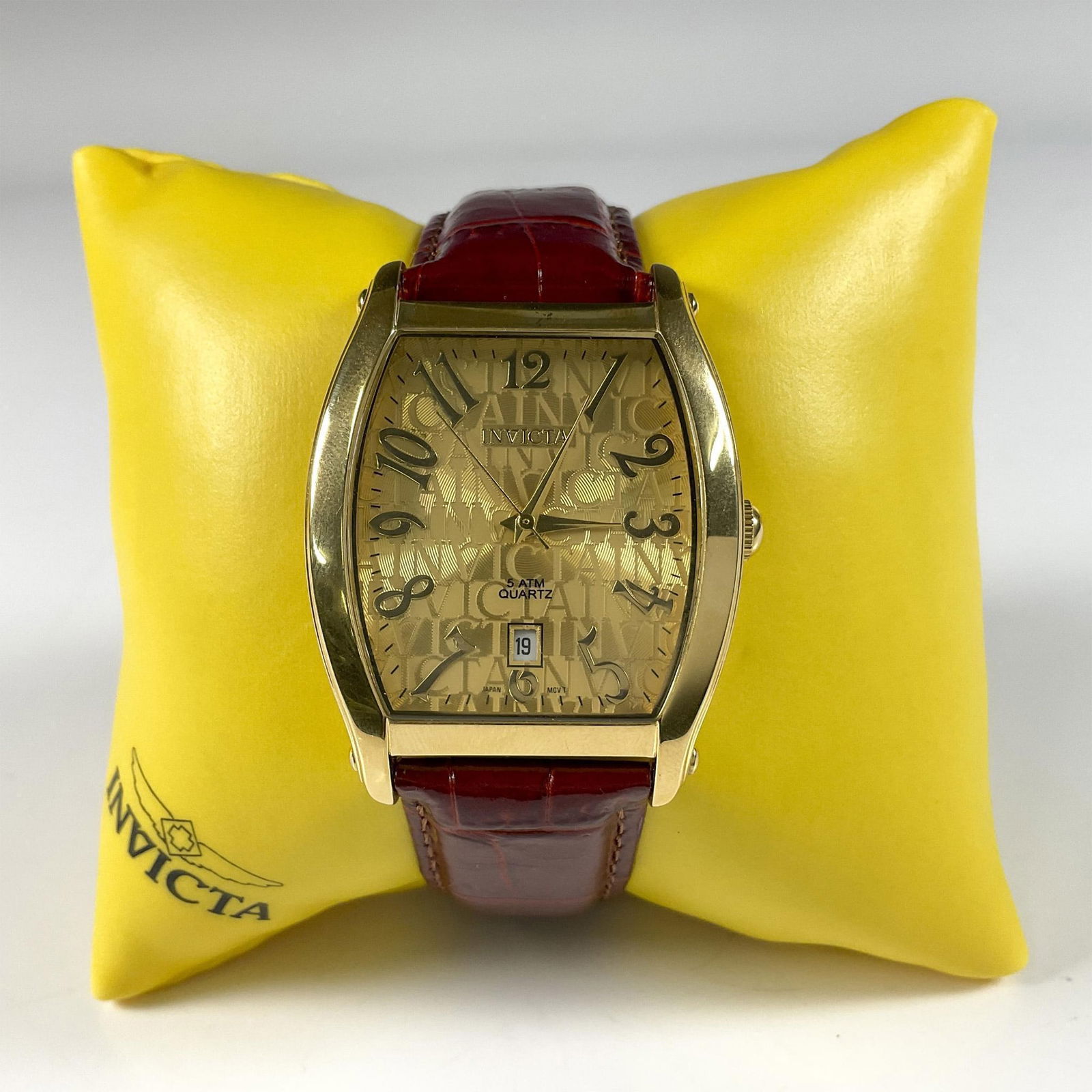 Rare Vintage Invicta 9882 Wristwatch: This gorgeous stainless steel wristwatch has dark red genuine leather strap. The face has gold quartz surface with gold numbers. This item has its original box 6"L x 4.5"W x 3"H. Issued: Vintage Dimen
