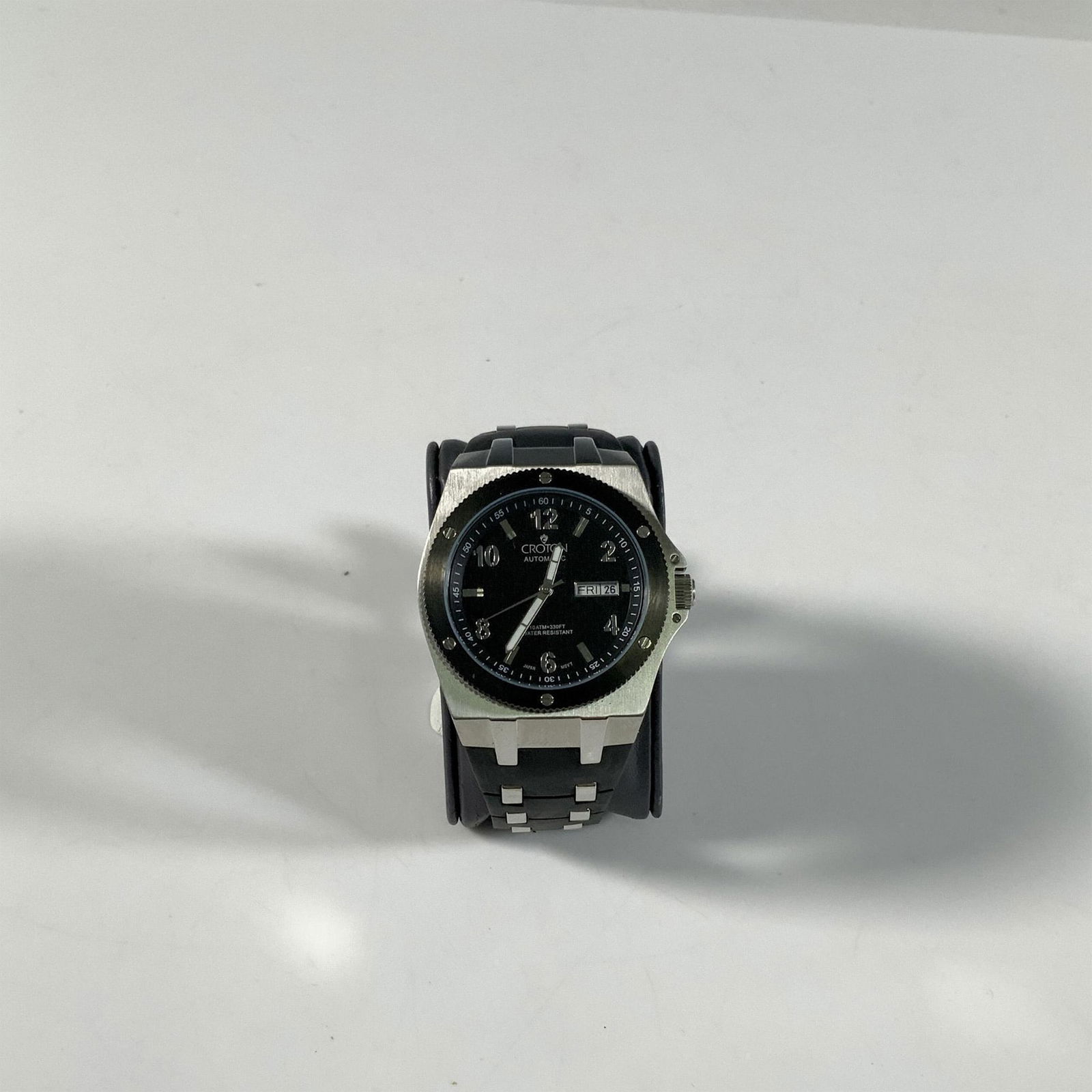 Croton 100m Water Resistant Automatic Watch: Stainless steel case, Japan movement, 10 ATM (330 ft) water resistant. The polyurethane band measures approximately 10.5"L x 0.75"W. Functionality not guaranteed. Dimensions: 39mm