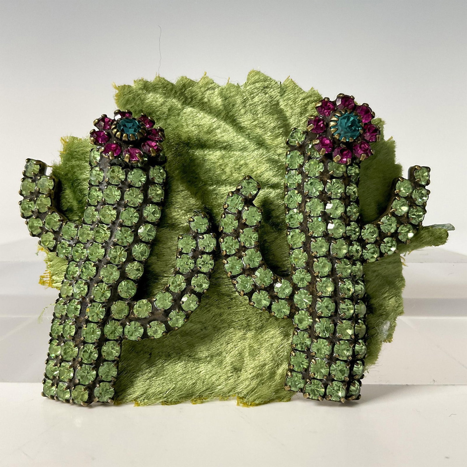 Dorothy Bauer Crystals Post Earrings, Cactus: Beautiful pair of green cactus with a lovely pink flower. Covered in embedded Austrian crystals. Includes certificate of authenticity. Issued: 20th century Dimensions: 1.5''H x 1''W, Each Manufacturer