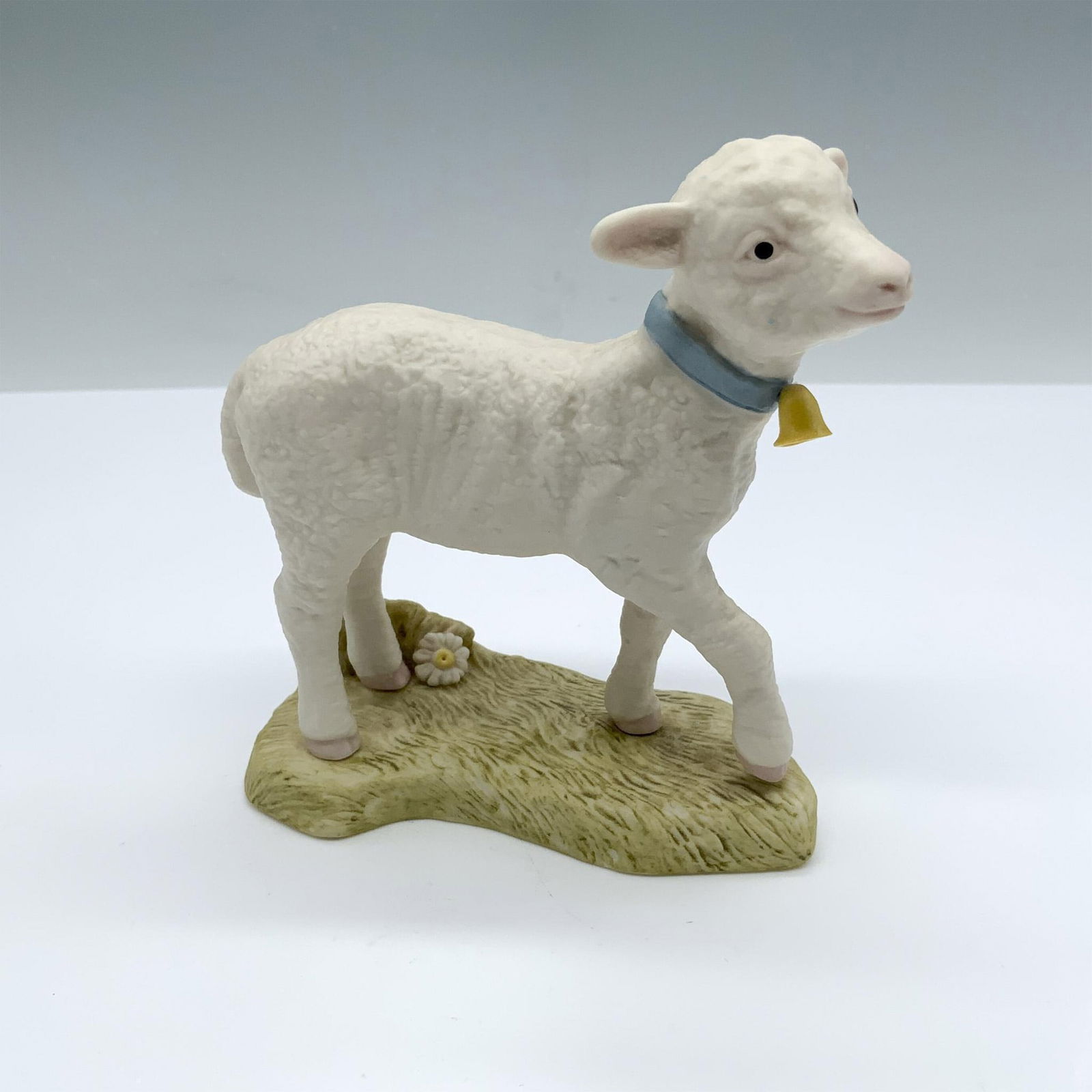 Cybis Porcelain Lamb Figurine, Mandy: Hand painted bisque porcelain. Cybis mark on the bottom. Dimensions: 4.5"L x 2"W x 4.5"H Manufacturer: Cybis Country of Origin: United States