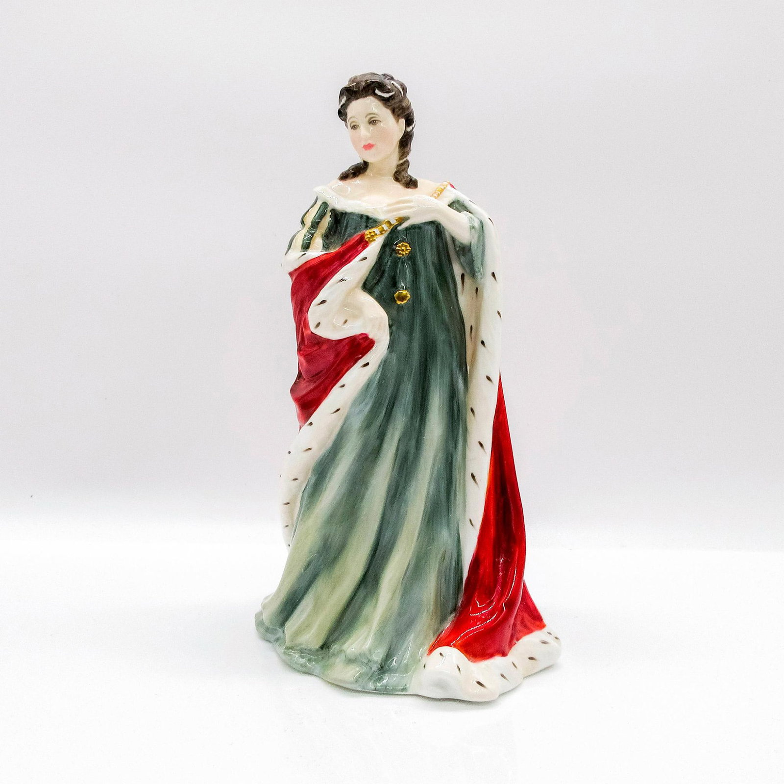Queen Anne HN3141 - Royal Doulton Figurine: Glazed porcelain figurine; Woman dressed in elaborate red and white coat with green dress and gold buttons. Royal Doulton backstamp. Includes Certificate of Authenticity. Artist: Pauline Parsons Issue