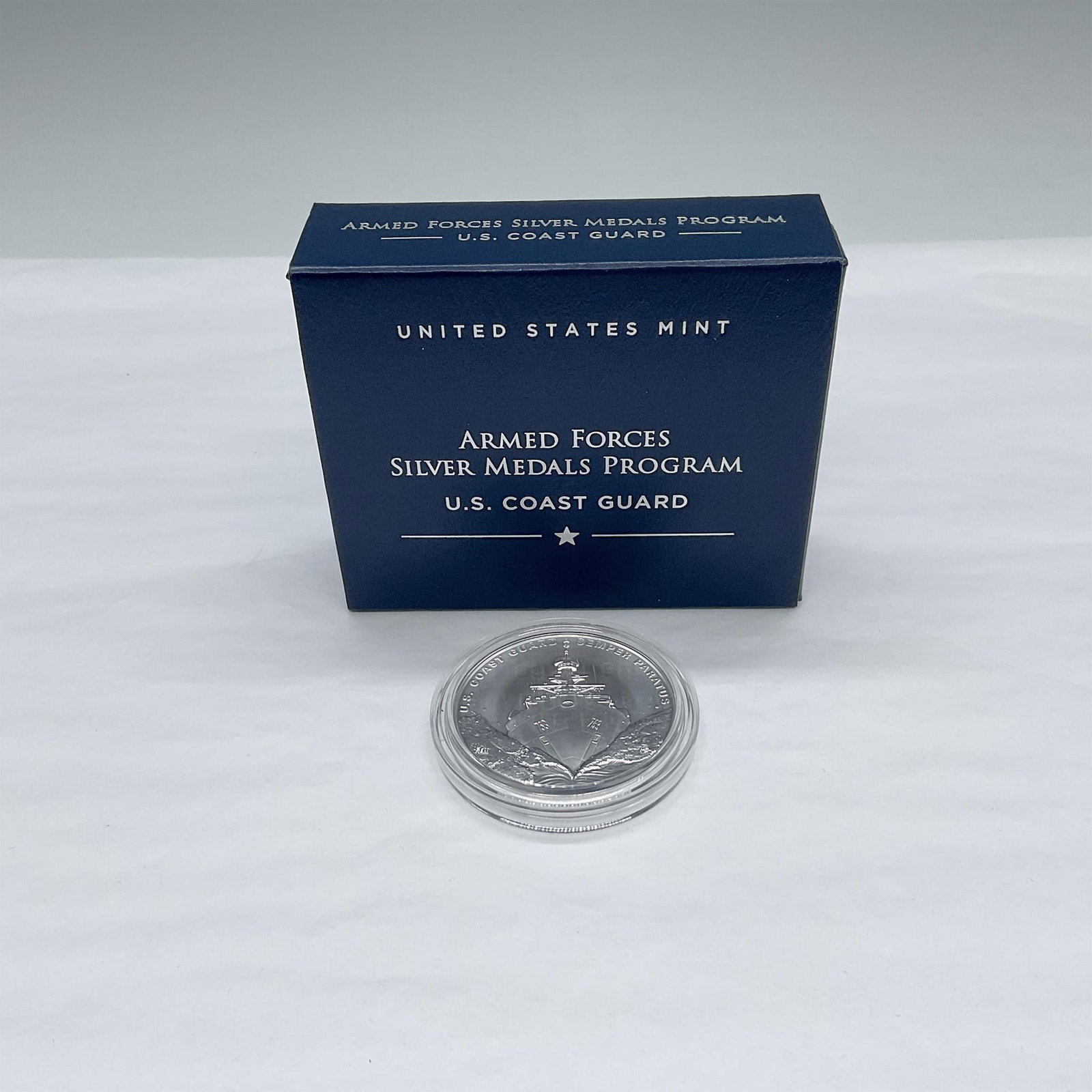 2021 U.S. Coast Guard 2.5 oz Silver Medal: The obverse side depicts the Coast Guard national security cutter, Hamilton. The reverse shows the Coast Guard emblem. The medal is in a protective case. Approximate measurement of a case: 0.25"D x 2"