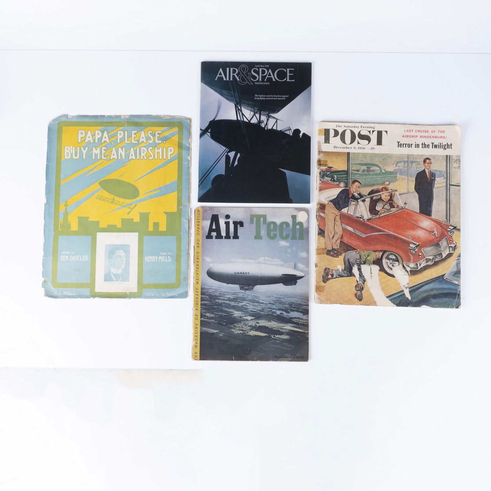 Set of Airships Antique Music Score & Vintage Magazines: This set includes: one original 1909 music score 'Papa, please buy me an airship,' with words by Ren Shields and music by Kerry Mills. Cover page includes a photograph of Arthur Fulton with the silhou