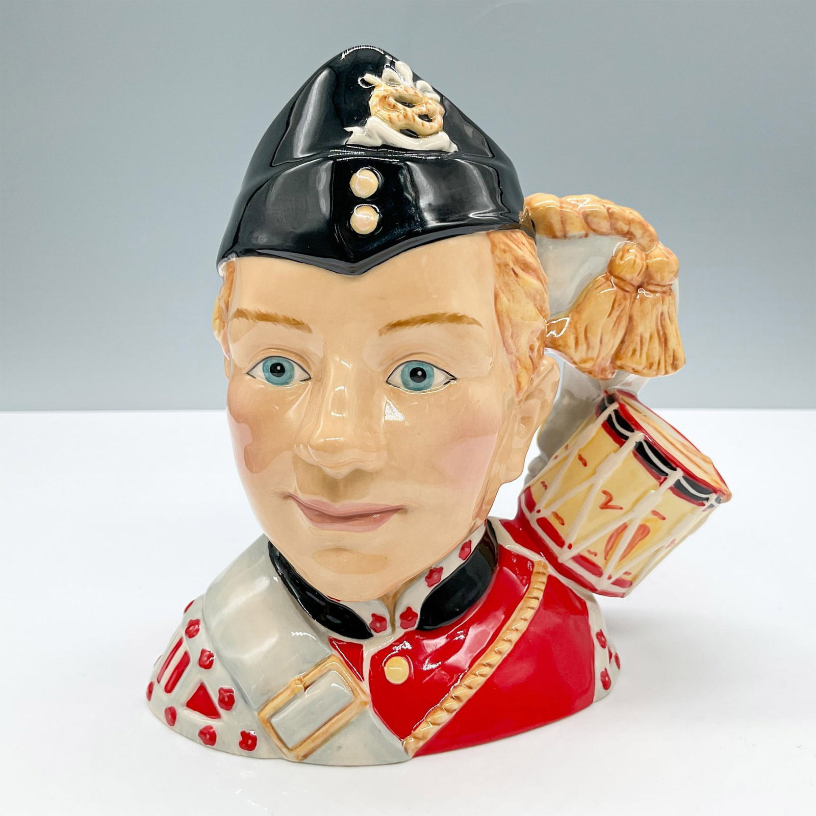 North Staffordshire Drummer Boy D7211 - Medium - Royal Doulton Character Jug: Royal Doulton backstamp. Artist: Unknown Issued: 2005 - 2005 Dimensions: 5.5"H Manufacturer: Royal Doulton Country of Origin: England