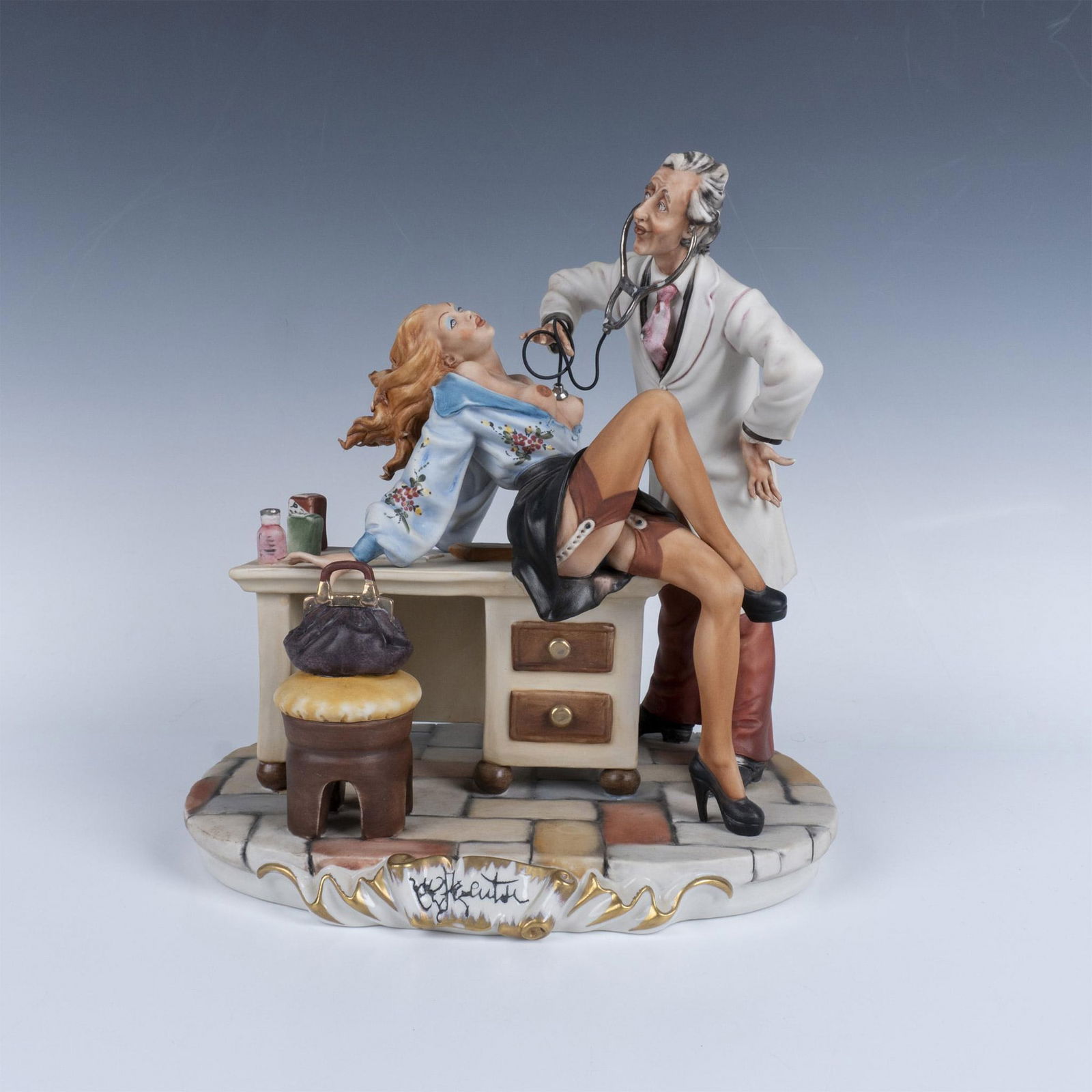 Enzo Arzenton Capodimonte Porcelain Sculpture, The Doctor: Limited edition hand-painted woman perched atop a desk while a doctor checks her heart rate. Figure attached to an oval base. Enzo Arzenton marked, Capodimonte backstamp. Artist: Enzo Arzenton Dimensi