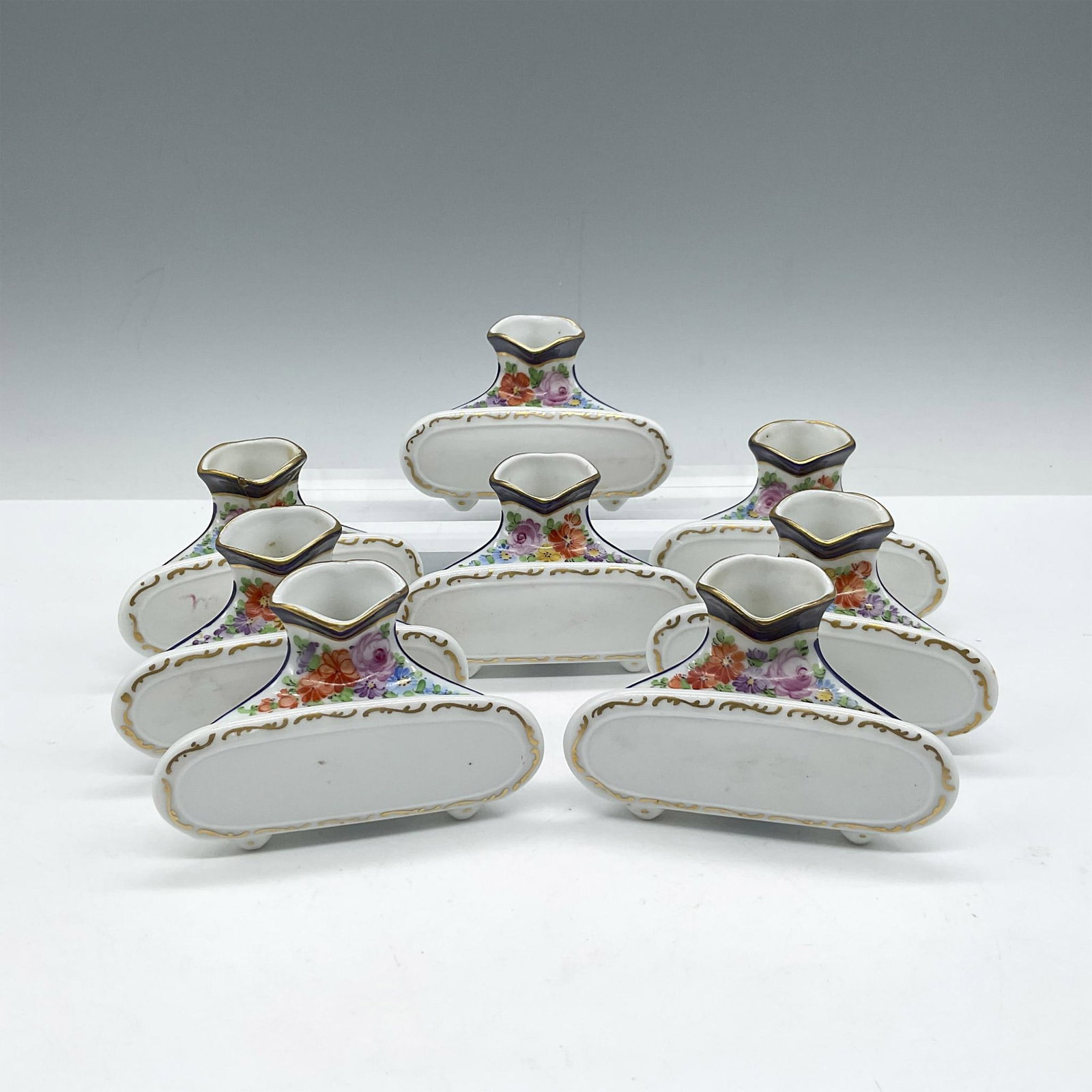 Franziska Hirsch Dresden Porcelain Place Card & Bud Vase, Set of 8: White porcelain hand painted with intricate flower motif accented by gilt rim and border. Dresden H with wings Franziska Hirsch Germany backstamp. Impressed 2840. Issued: 1901-1914 Dimensions: 3.5"L x