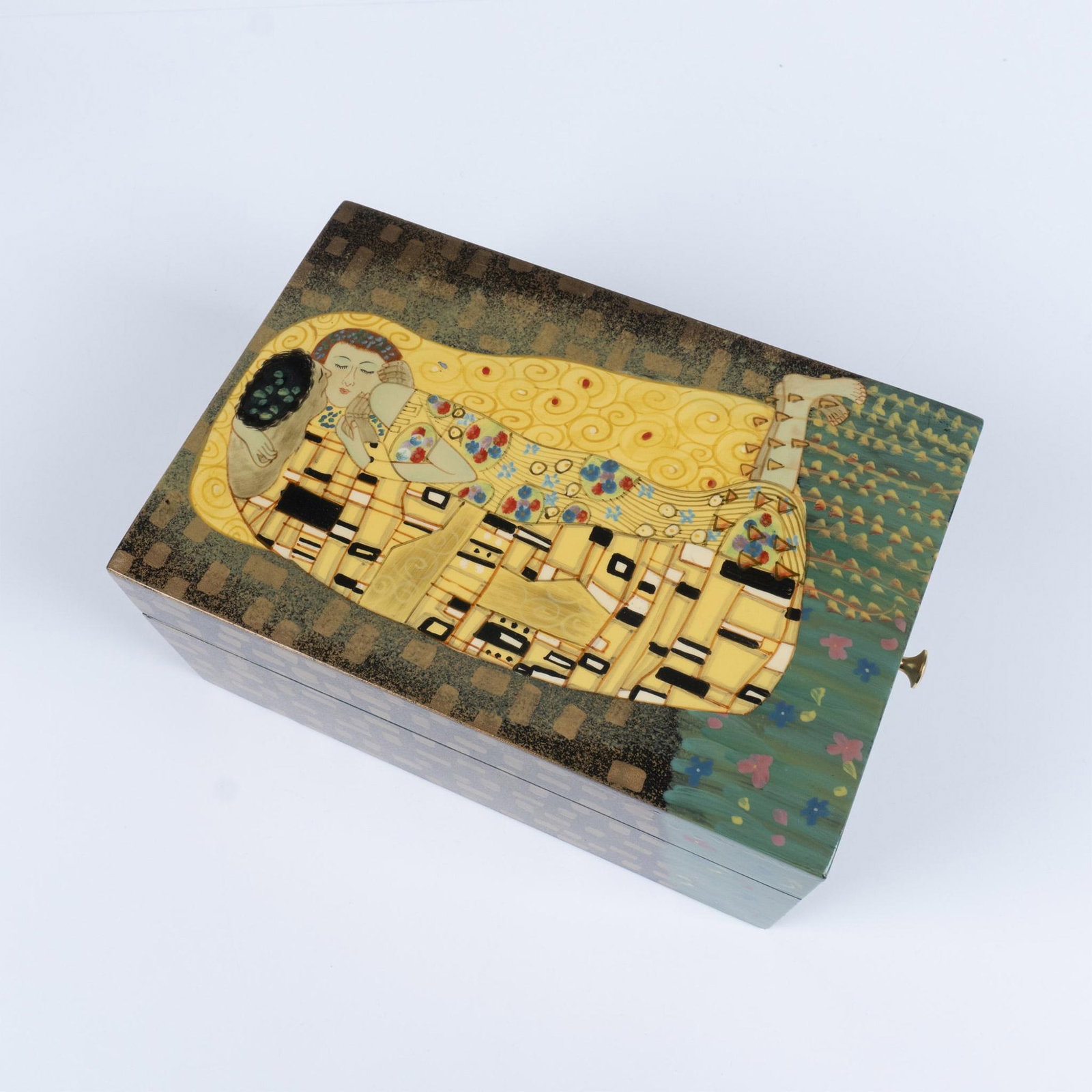 After Gustav Klimt (Austrian, 1862-1918), The Kiss Box: Inspired by Gustav Klimt, a hinged covered decorated box depicts the Austrian's most notable painting, The Kiss. Dimensions: 9.25"L x 6"W x 4"H