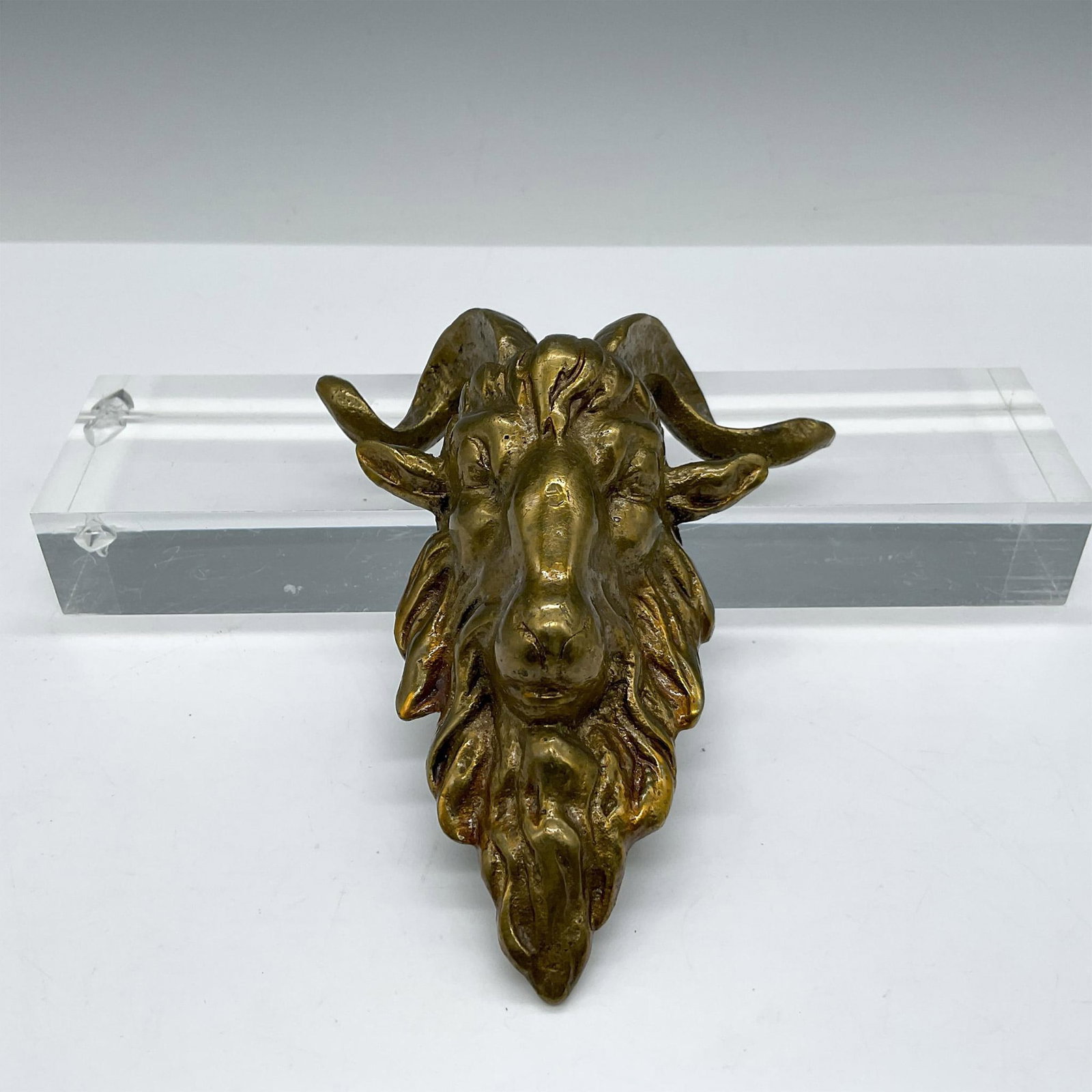 Vintage Brass Ormolu Rams Head Sculpture: Gilt brass sculpted hardware in rams head design. Issued: 20th century Dimensions: 4.75"L x 4"W x 1.75"H