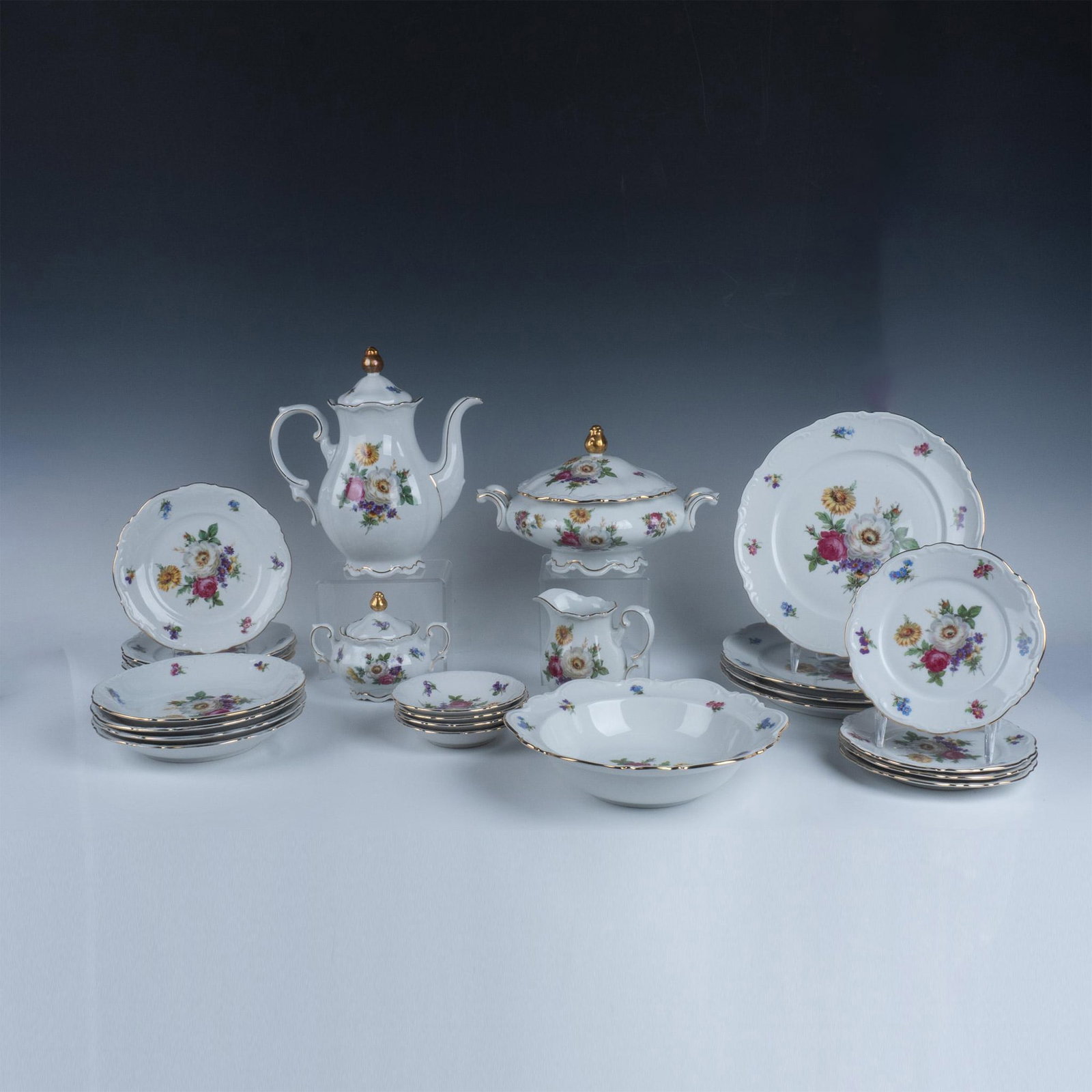 28pc Meissen Floral by Mitterteich Porcelain Dinnerware: Colorful and beautiful design of flowers in center with small bouquets along edge. Gilt rim accents design. Lot includes 4 Dinner plates (10.25"); 4 Salad plates (8"); 4 Bread plates (7"); 4 Coupe Sou